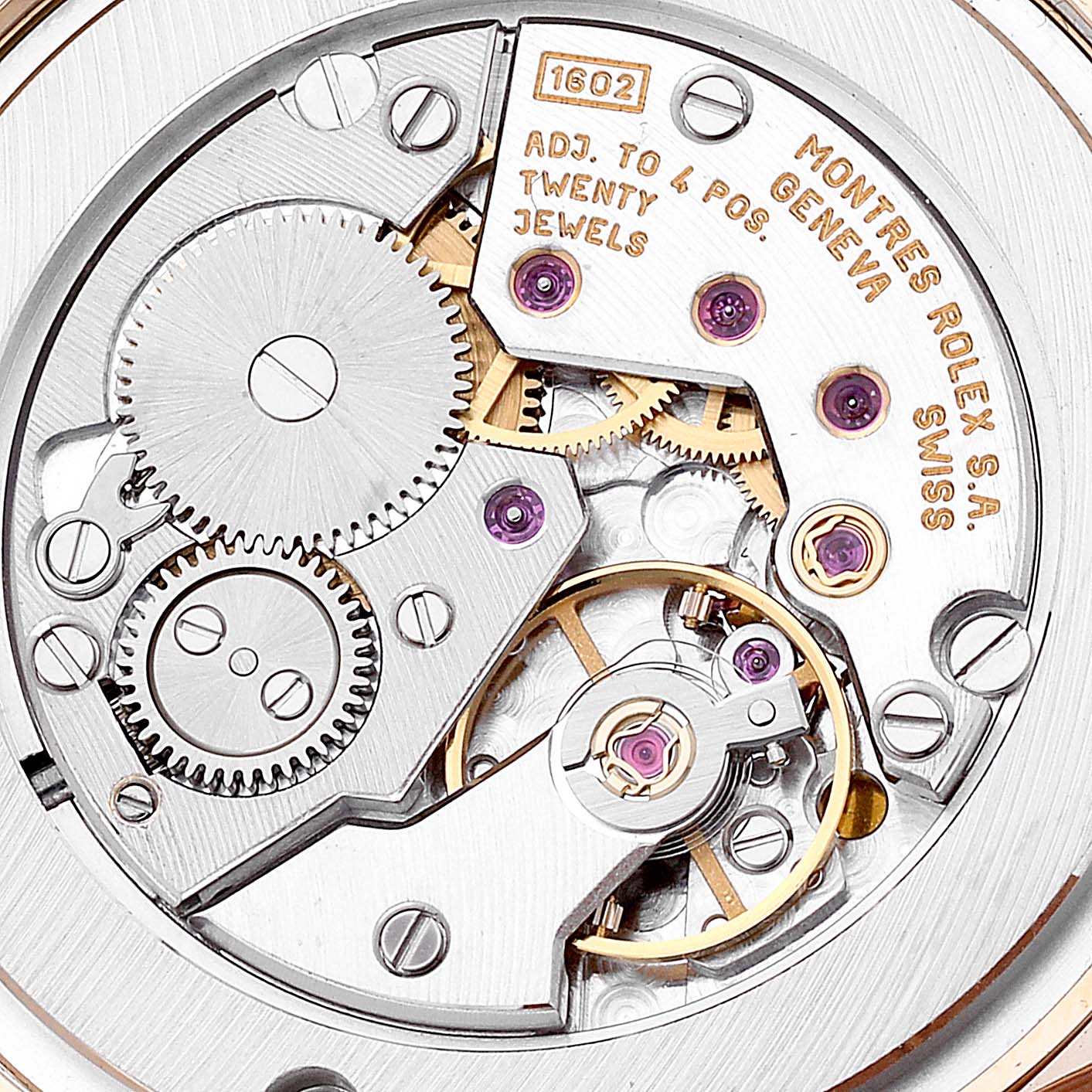 This image shows a close-up of the movement inside a Rolex Cellini 5115 Men's Yellow Gold Silver Dial 5115 Men's Yellow Gold Silver Dial watch, highlighting the gears and intricate mechanics.