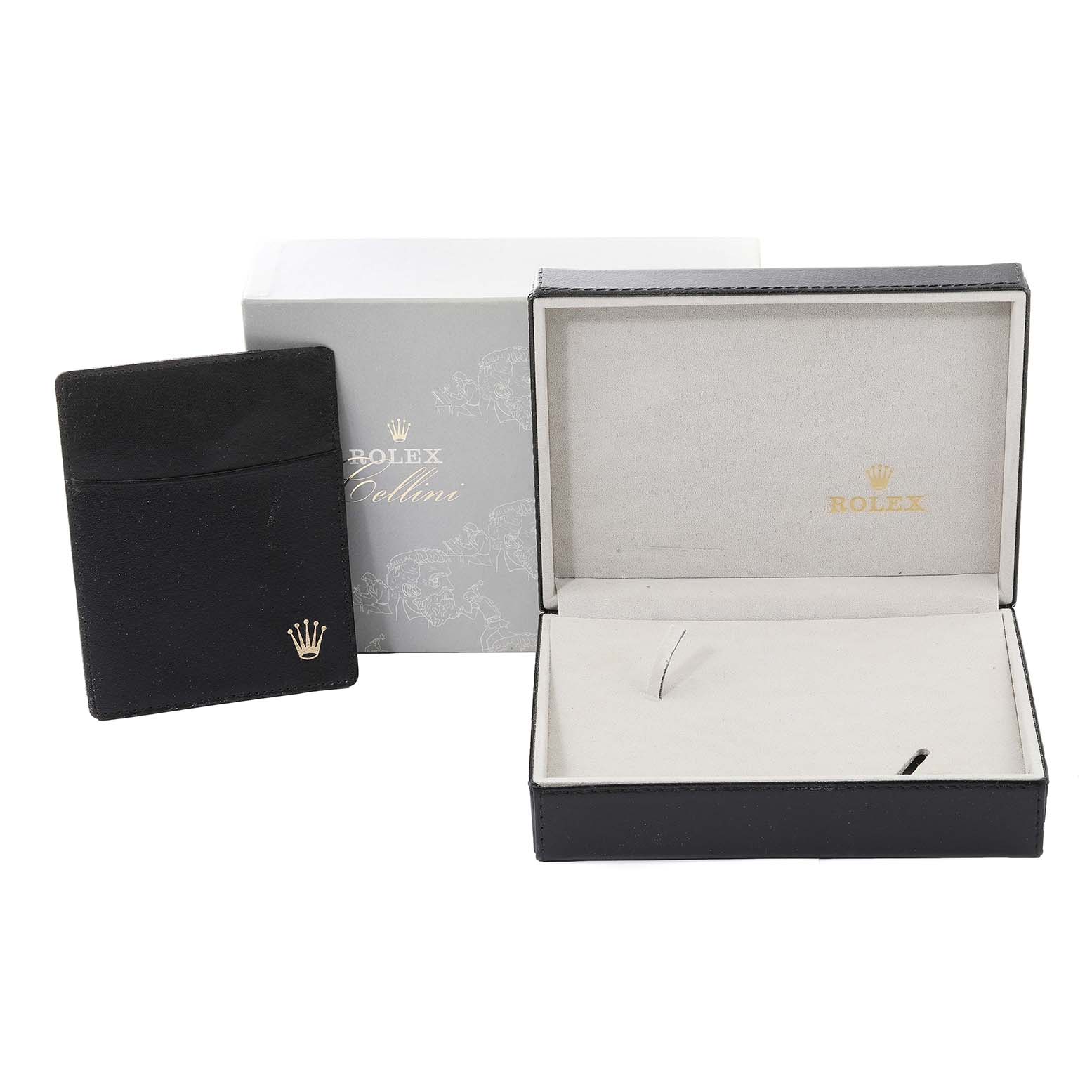 This image shows the packaging and accessories for a Rolex Cellini 5115 Men's Yellow Gold Silver Dial 5115 Men's Yellow Gold Silver Dial model, including the box, an open display case, and a pouch.
