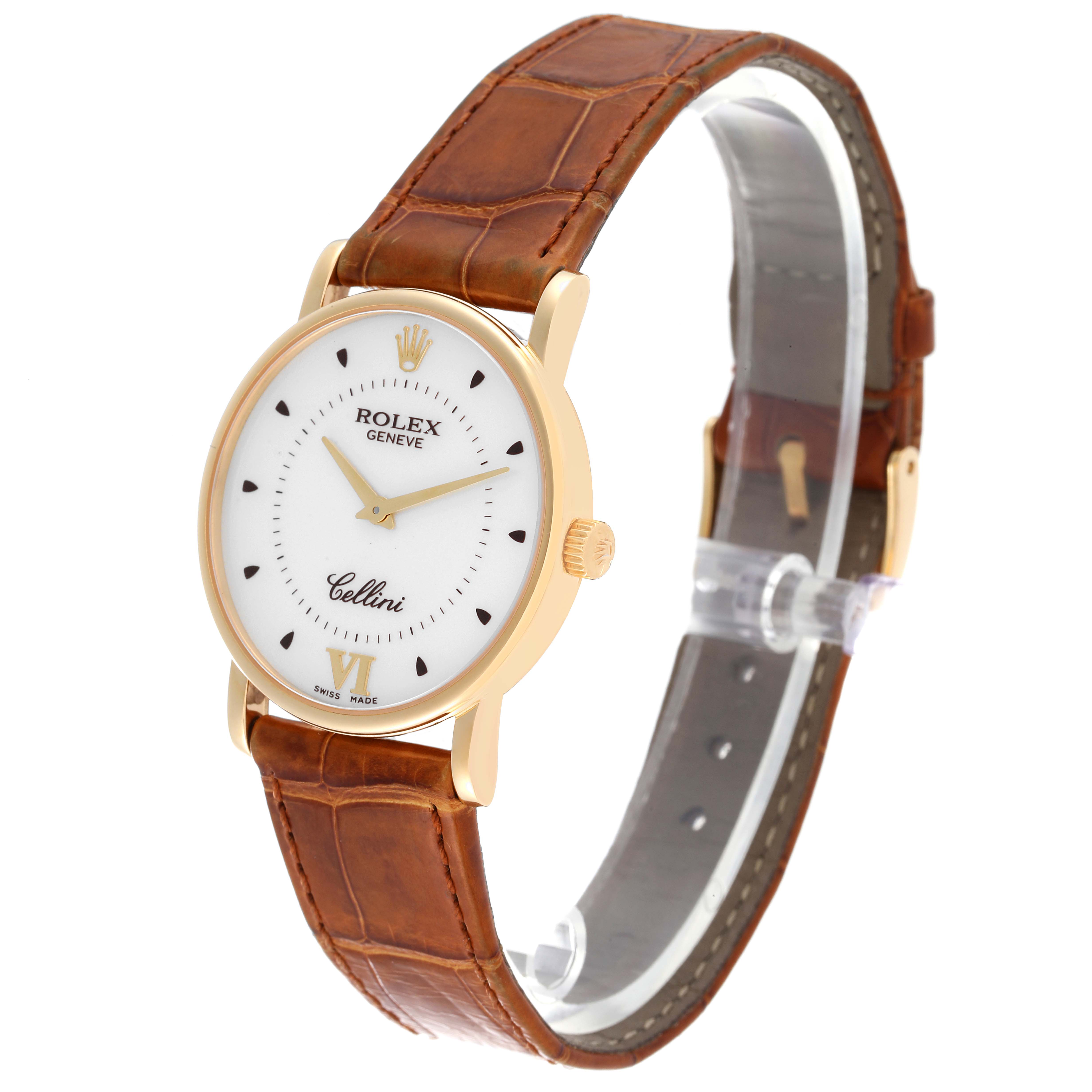 The Rolex Cellini 5115 Men's Yellow Gold Silver Dial 5115 Men's Yellow Gold Silver Dial watch is angled slightly to the right, showcasing its gold case, white dial, and brown leather strap.