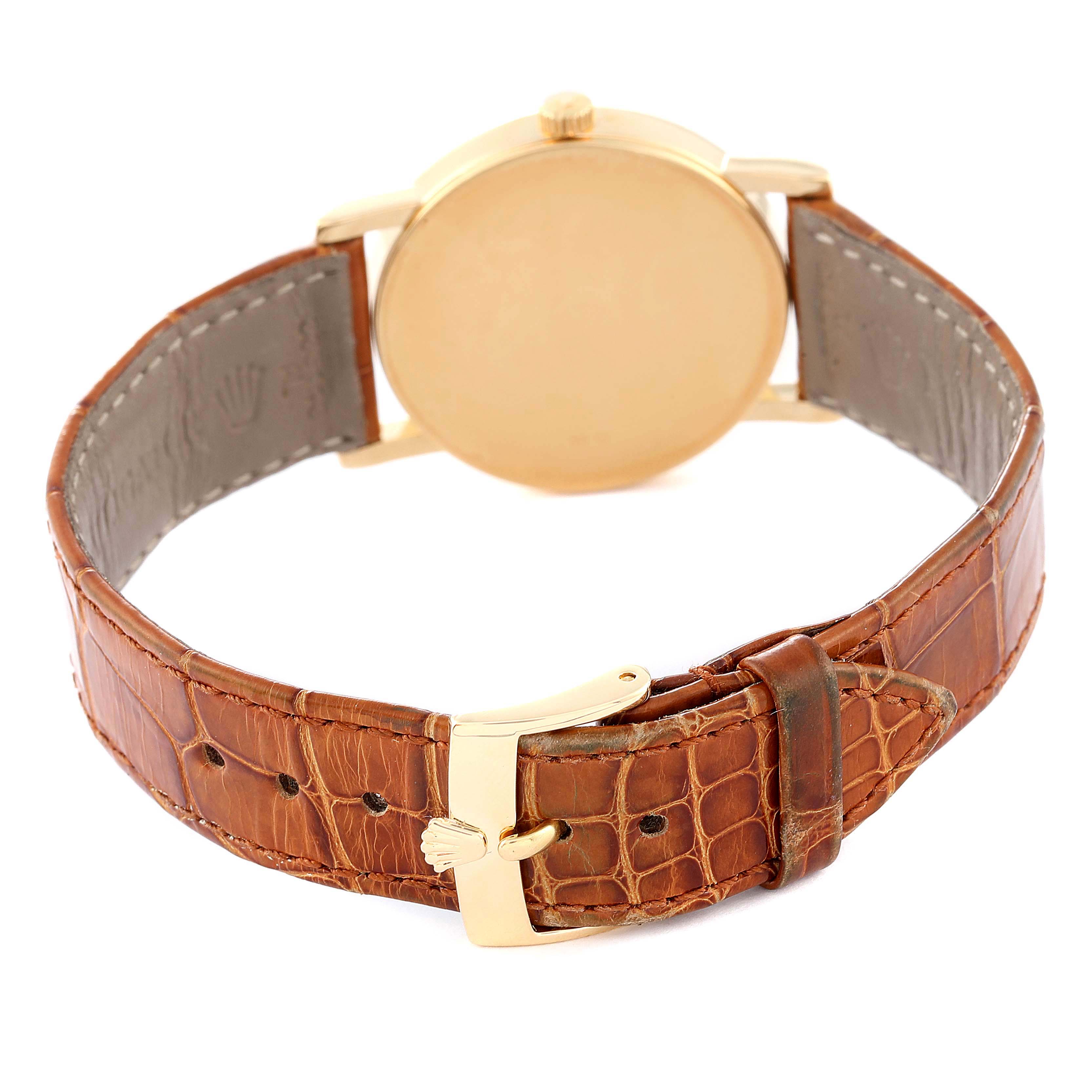 The image shows the back view of a Rolex Cellini 5115 Men's Yellow Gold Silver Dial 5115 Men's Yellow Gold Silver Dial watch focusing on its brown leather strap and gold buckle.