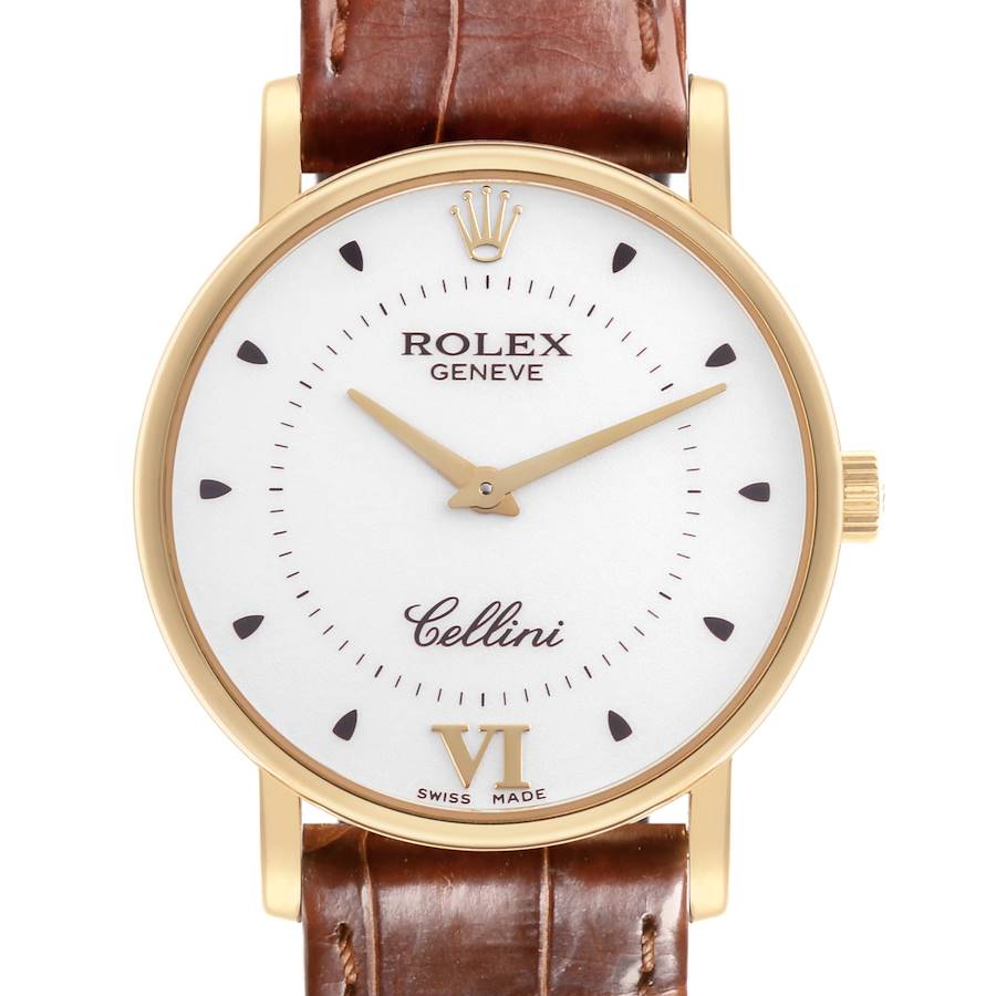 The Rolex Date model is shown from the front, displaying its face, bezel, and brown leather strap.