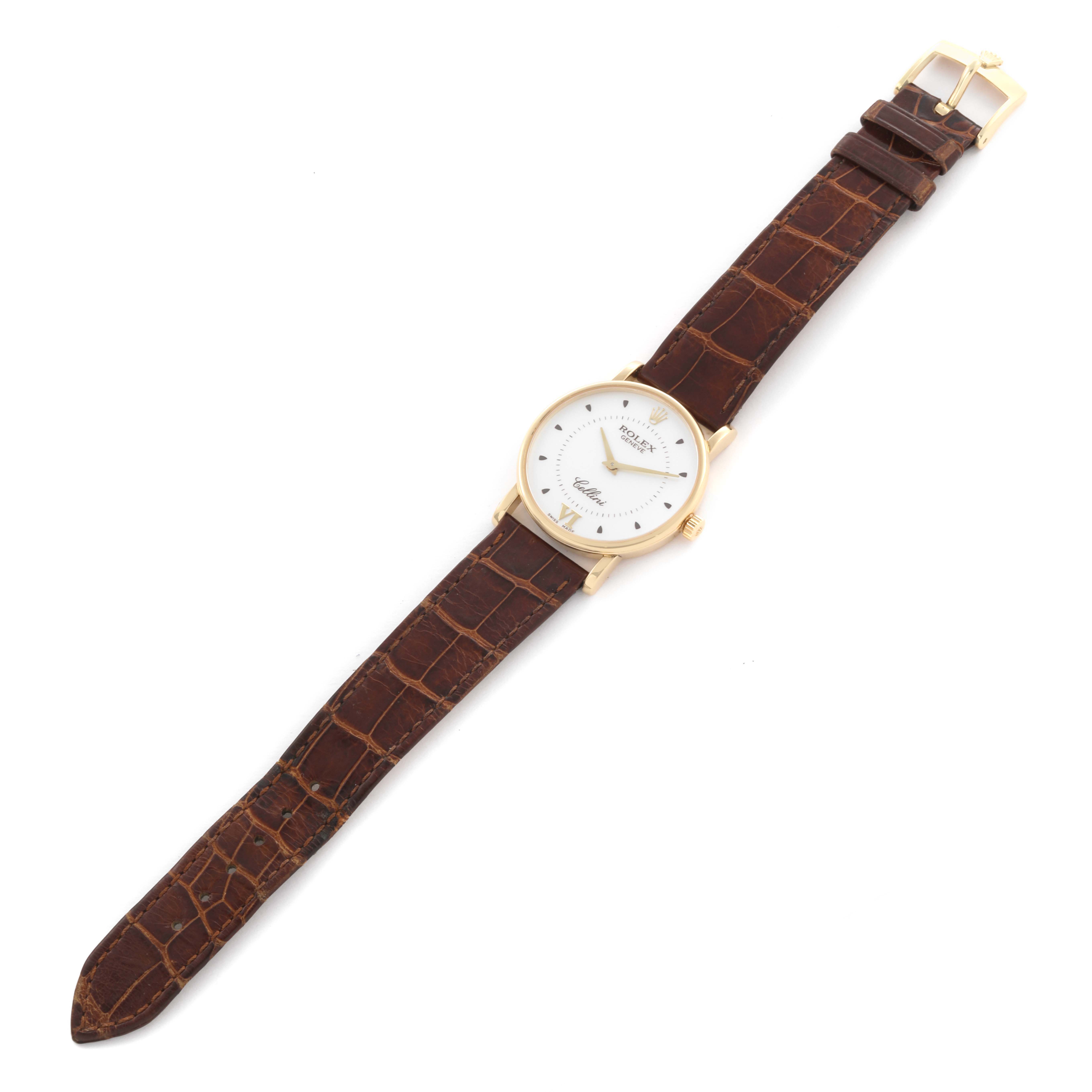 The Rolex Date 5115 Men's Yellow Gold Silver Dial 5115 Men's Yellow Gold Silver Dial model is shown from a top view, featuring a gold case, white dial, and brown leather strap.