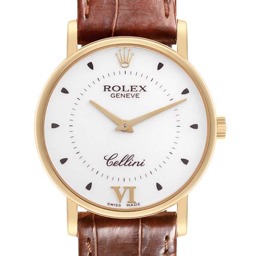 The Rolex Date model is shown from the front, displaying its white dial, brown leather strap, and gold detailing.