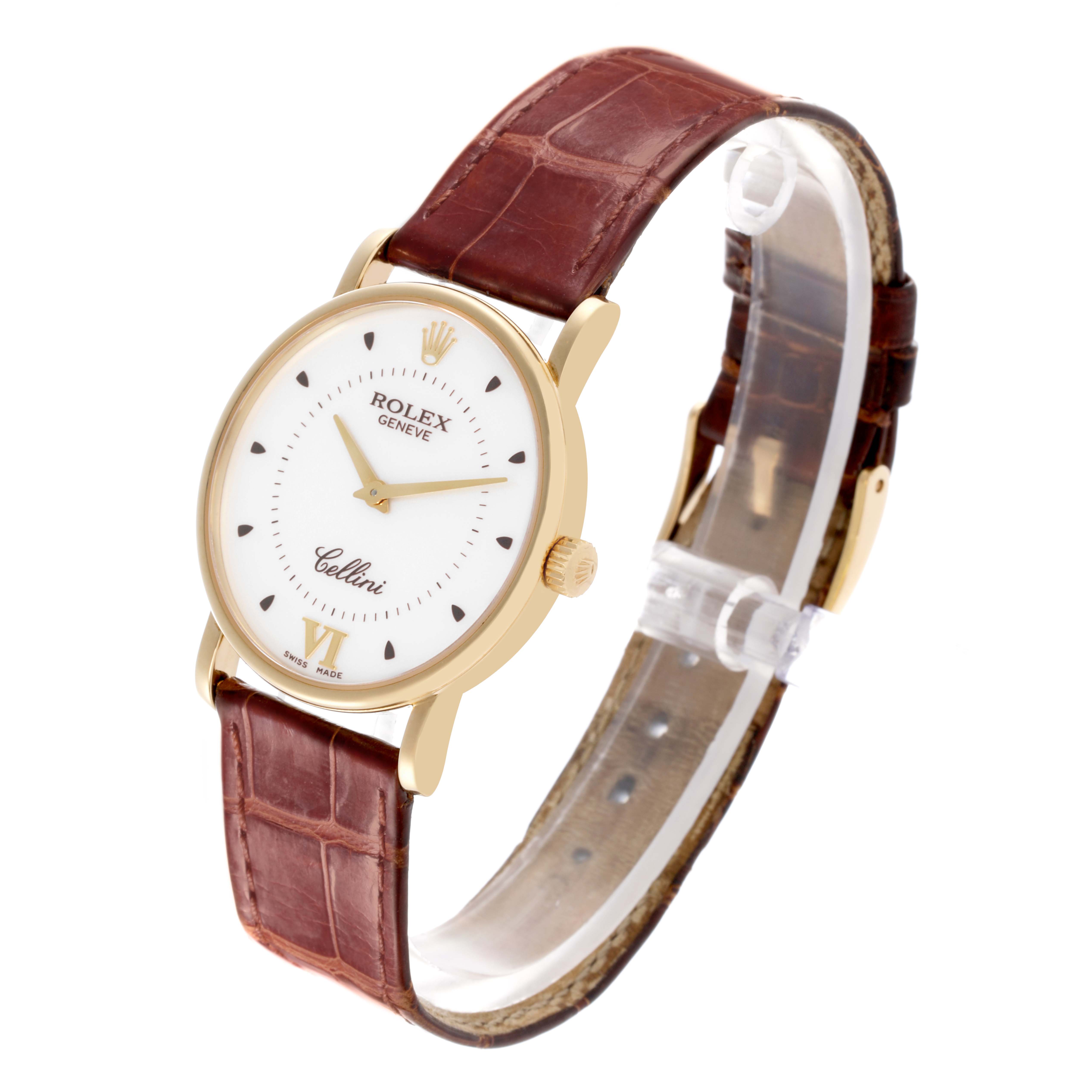 The Rolex Cellini watch is shown at a slight angle, displaying the face, crown, and brown leather strap.