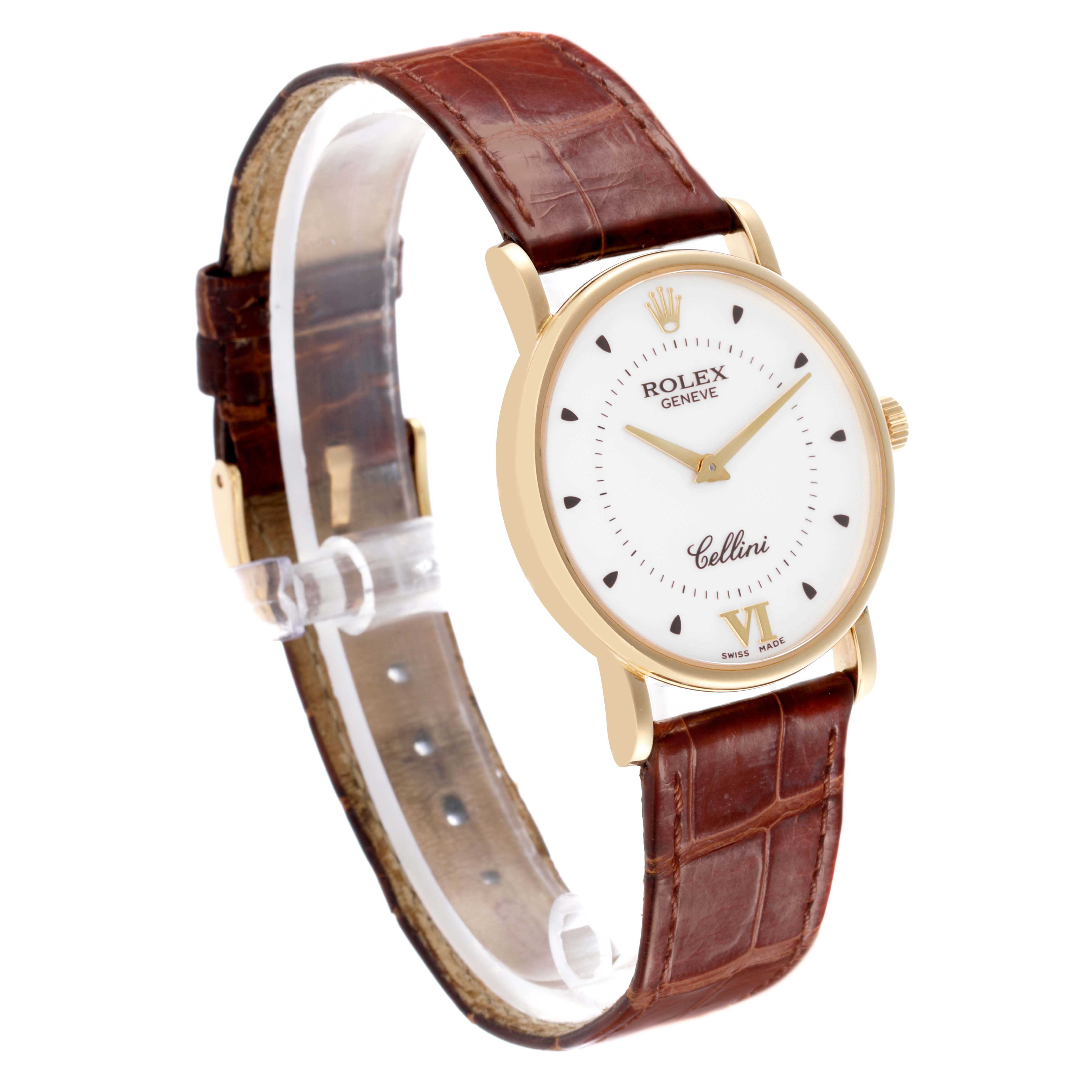 The image shows a side angle of a Rolex Cellini, highlighting the watch face, case, and brown leather strap.