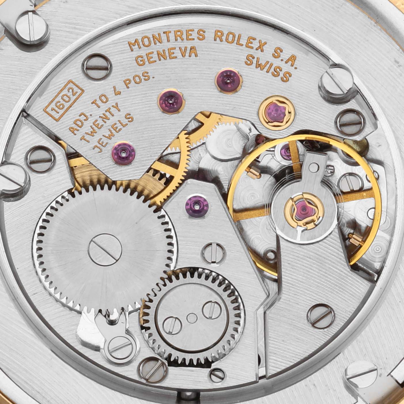 This image shows the movement of a Rolex Date 5115 Men's Yellow Gold Silver Dial 5115 Men's Yellow Gold Silver Dial watch model, highlighting gears, jewels, and intricate mechanisms.
