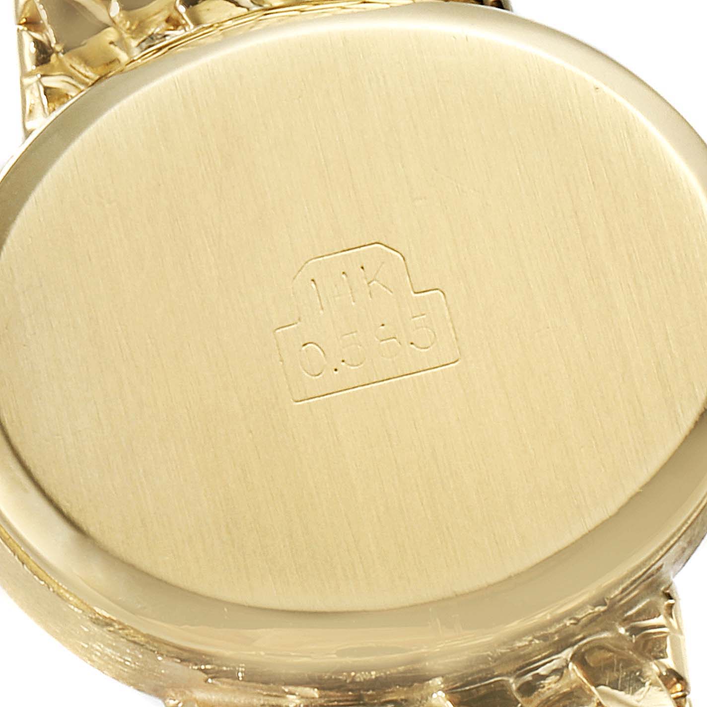 This image shows the back case of a Rolex Cocktail  Women
s Yellow Gold Champagne Dial  Women
s Yellow Gold Champagne Dial model watch at a close-up angle.