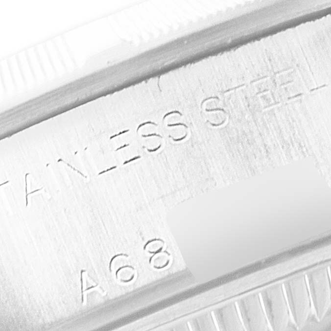 This close-up image shows the engraved stainless steel marking on the side of a Rolex Date 79190 Women's Stainless Steel Black Dial 79190 Women's Stainless Steel Black Dial watch case.