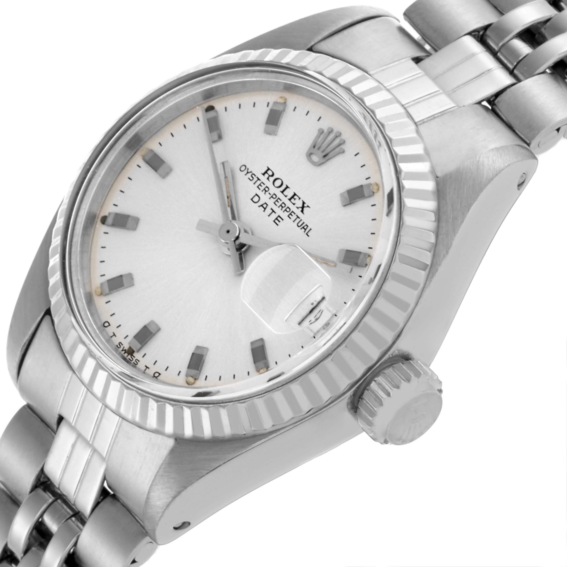 The Rolex Date 6917 Women's Stainless Steel Silver Dial 6917 Women's Stainless Steel Silver Dial model is shown at an angled close-up, highlighting the dial, fluted bezel, crown, and part of the bracelet.