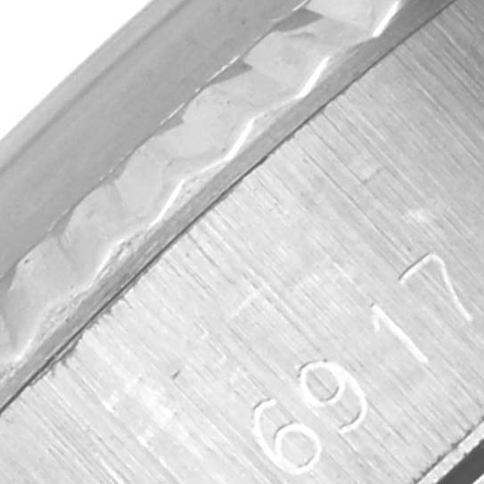 The image shows a close-up of the inner bezel with partially visible engravings on the Rolex Date 6917 Women's Stainless Steel Silver Dial 6917 Women's Stainless Steel Silver Dial model watch.