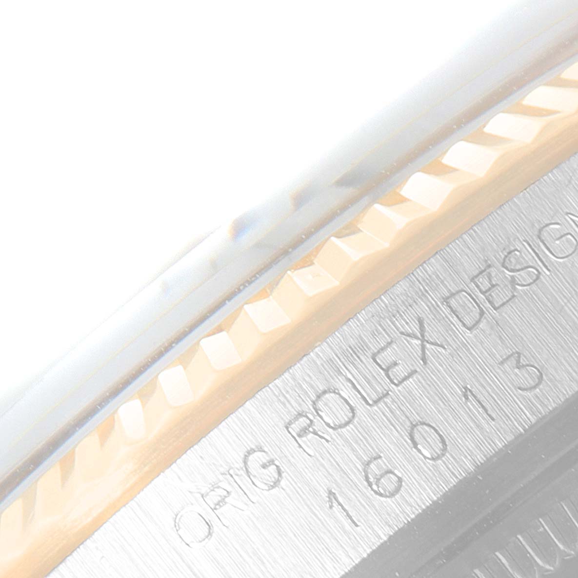 This image shows a close-up of the side engraving and bezel of a Vintage Collection Rolex watch, Model 16013.