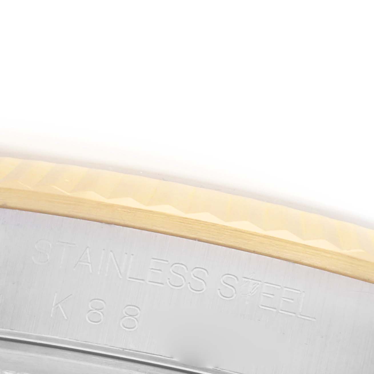 The image shows a close-up of the bezel and etched markings on the stainless steel of a Rolex Datejust 16233 Men's Steel and Gold (two tone) White Dial 16233 Men's Steel and Gold (two tone) White Dial watch.