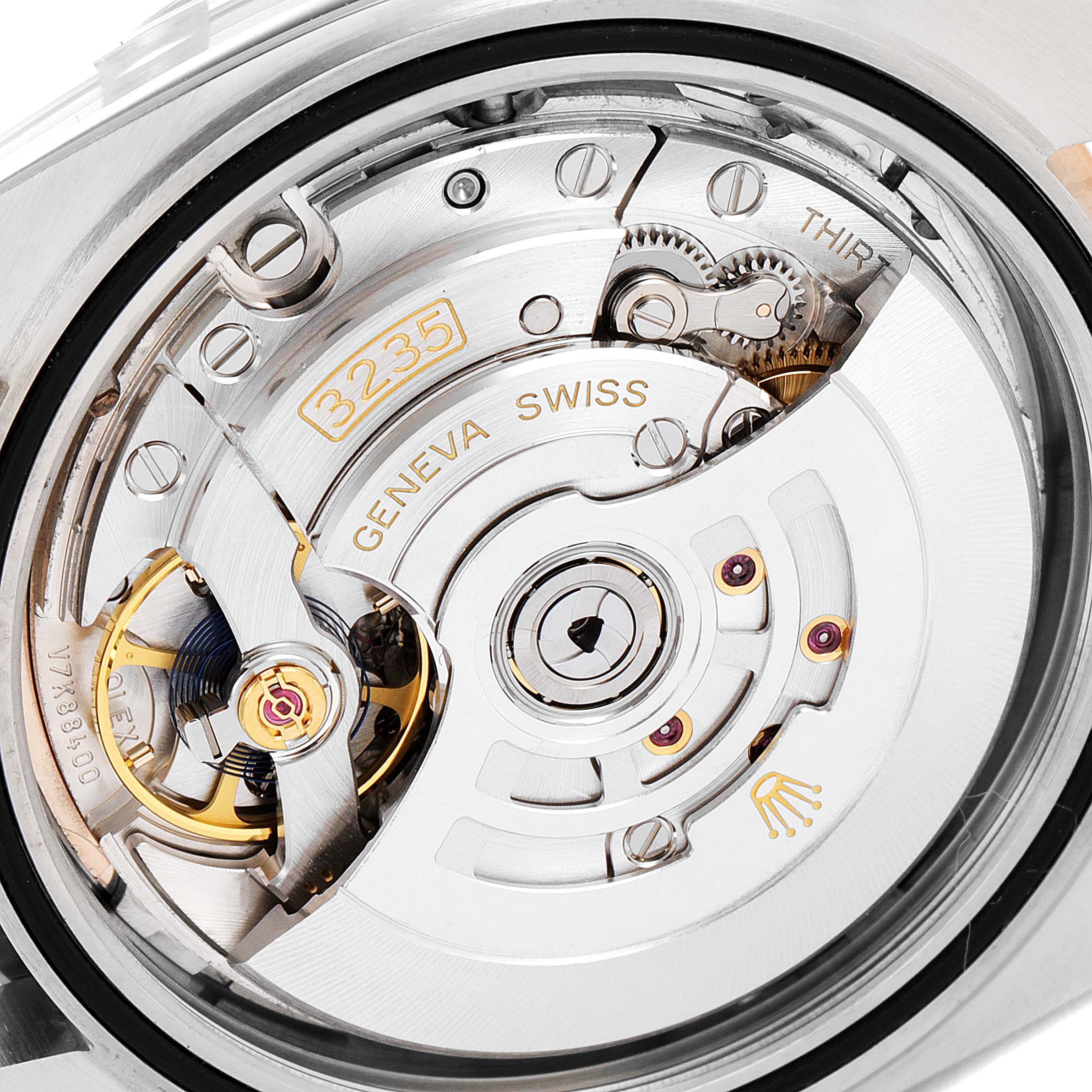 The image shows the back view of the movement mechanism inside a Rolex Datejust 41 126301 Men's Steel and Gold (two tone) Pink Dial 126301 Men's Steel and Gold (two tone) Pink Dial watch.