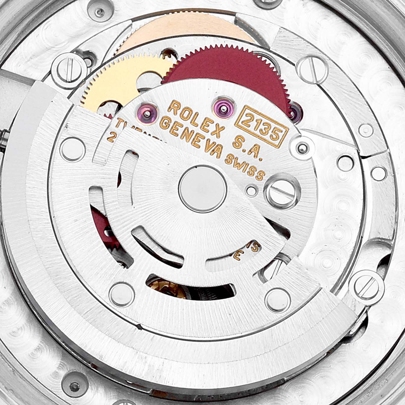 The image shows the internal movement of a Rolex Mid-Size 68274 Women's Stainless Steel Blue Dial 68274 Women's Stainless Steel Blue Dial watch, highlighting the gears and rotor mechanism.