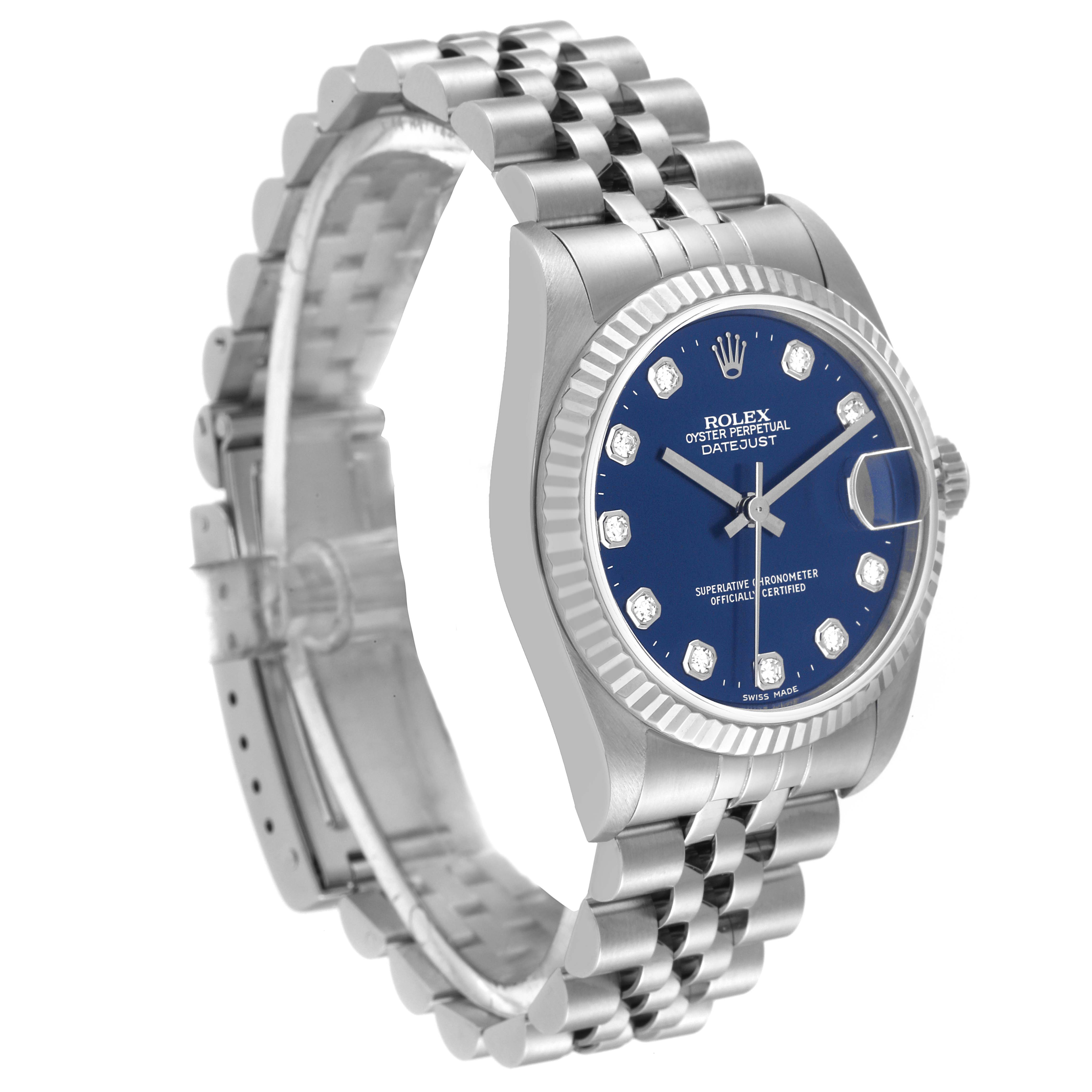 The image shows a Rolex Oyster Perpetual Datejust Mid-Size watch at a slight angled side view, highlighting its blue dial, bezel, and bracelet.