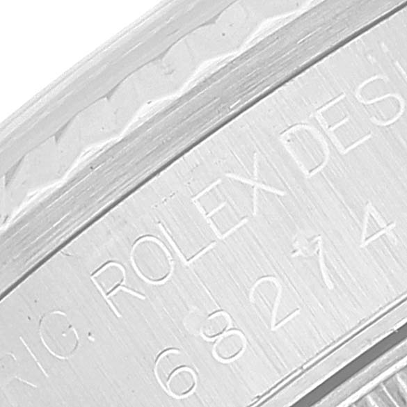This close-up image shows the engraved side view of the Mid-Size Rolex model, highlighting the "Rolex Design" text.