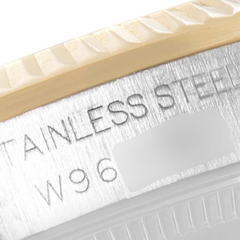 This is a close-up angle of the Rolex Mid-Size 68273 Women
s Steel and Gold (two tone) Black Dial 68273 Women
s Steel and Gold (two tone) Black Dial watch case, showing the stainless steel text and part of the bezel.