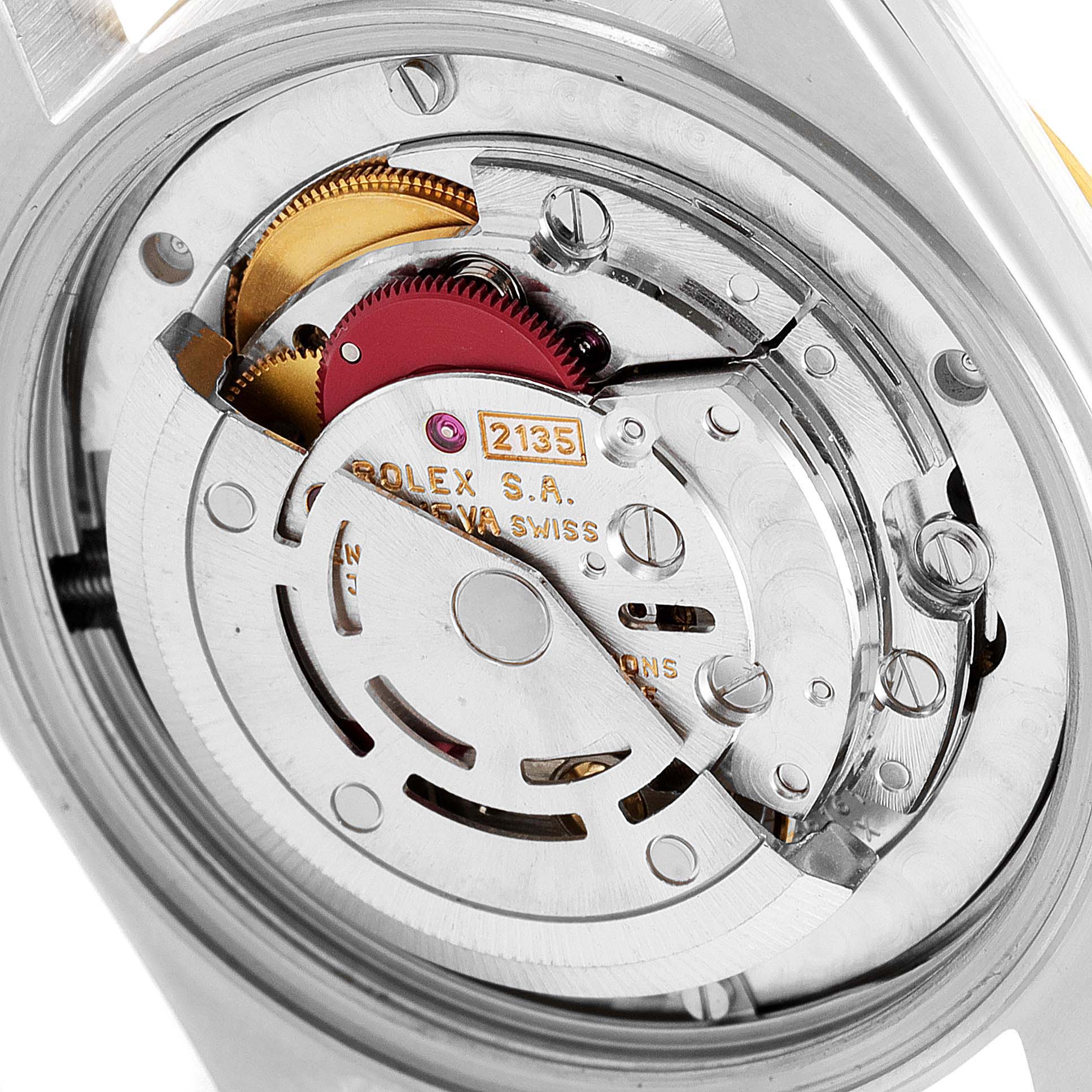 The image shows the inner mechanical movement of a Rolex Mid-Size 68273 Women
s Steel and Gold (two tone) Black Dial 68273 Women
s Steel and Gold (two tone) Black Dial model watch from a close-up angle.