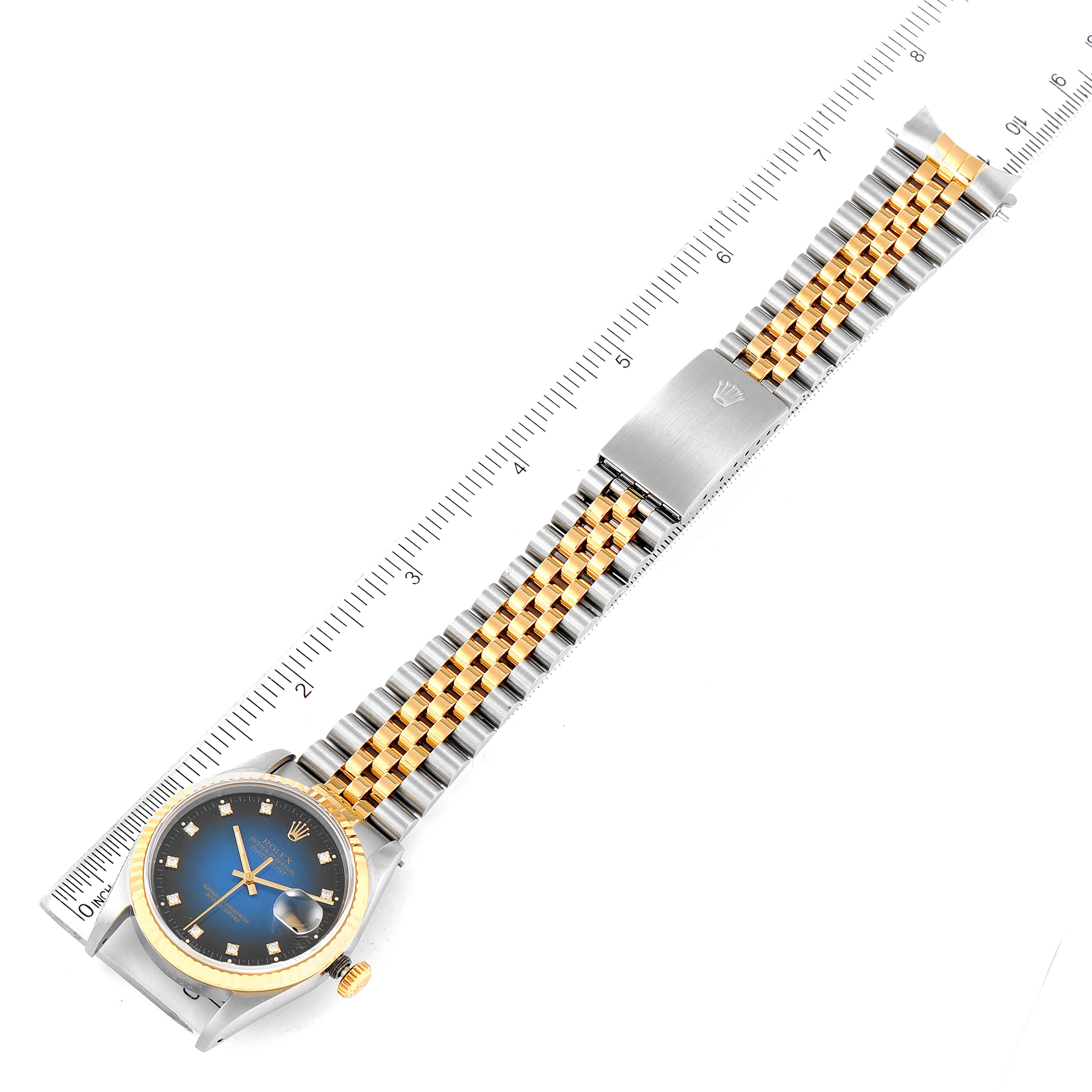 The image shows a Rolex Datejust 16233 Men's Steel and Gold (two tone) Blue Dial 16233 Men's Steel and Gold (two tone) Blue Dial watch from a top-down angle, featuring the case, bezel, dial, and bracelet.