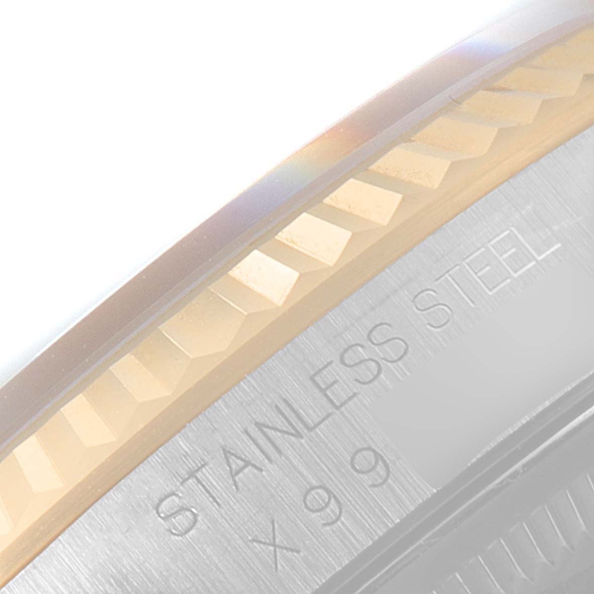 The image shows a close-up of the fluted bezel and part of the case of a Rolex Datejust 16233 Men's Steel and Gold (two tone) Blue Dial 16233 Men's Steel and Gold (two tone) Blue Dial watch, highlighting "STAINLESS STEEL."