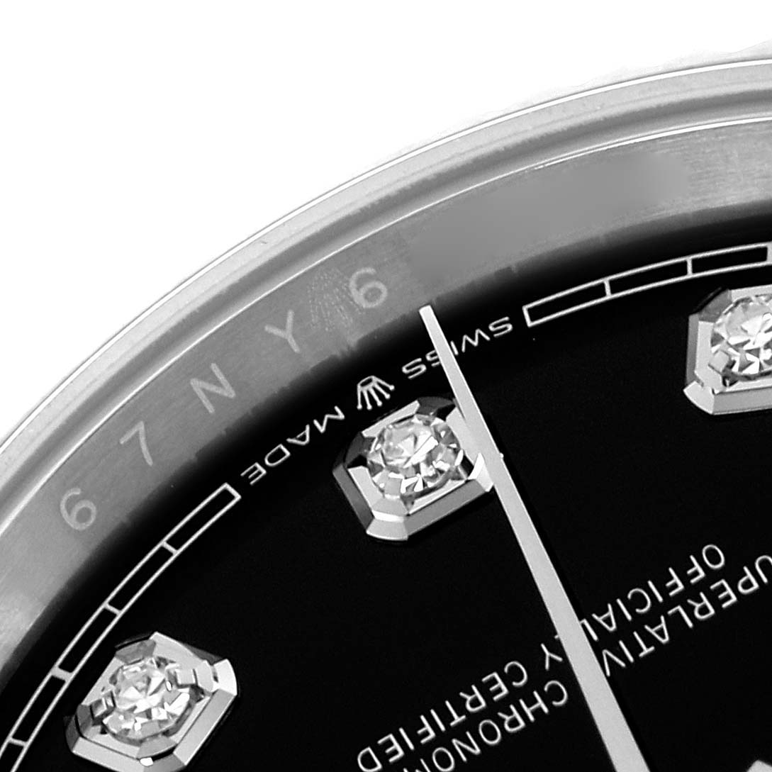 The image shows a close-up of the dial of a Rolex Datejust 126234 Men's Stainless Steel Black Dial 126234 Men's Stainless Steel Black Dial, highlighting diamond hour markers and part of the bezel.