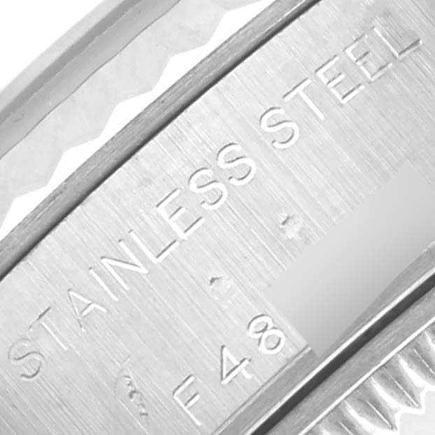 The image shows a close-up of the side of a Rolex Datejust 79174 Women's Stainless Steel Pink Dial 79174 Women's Stainless Steel Pink Dial, focusing on the "STAINLESS STEEL" engraving.