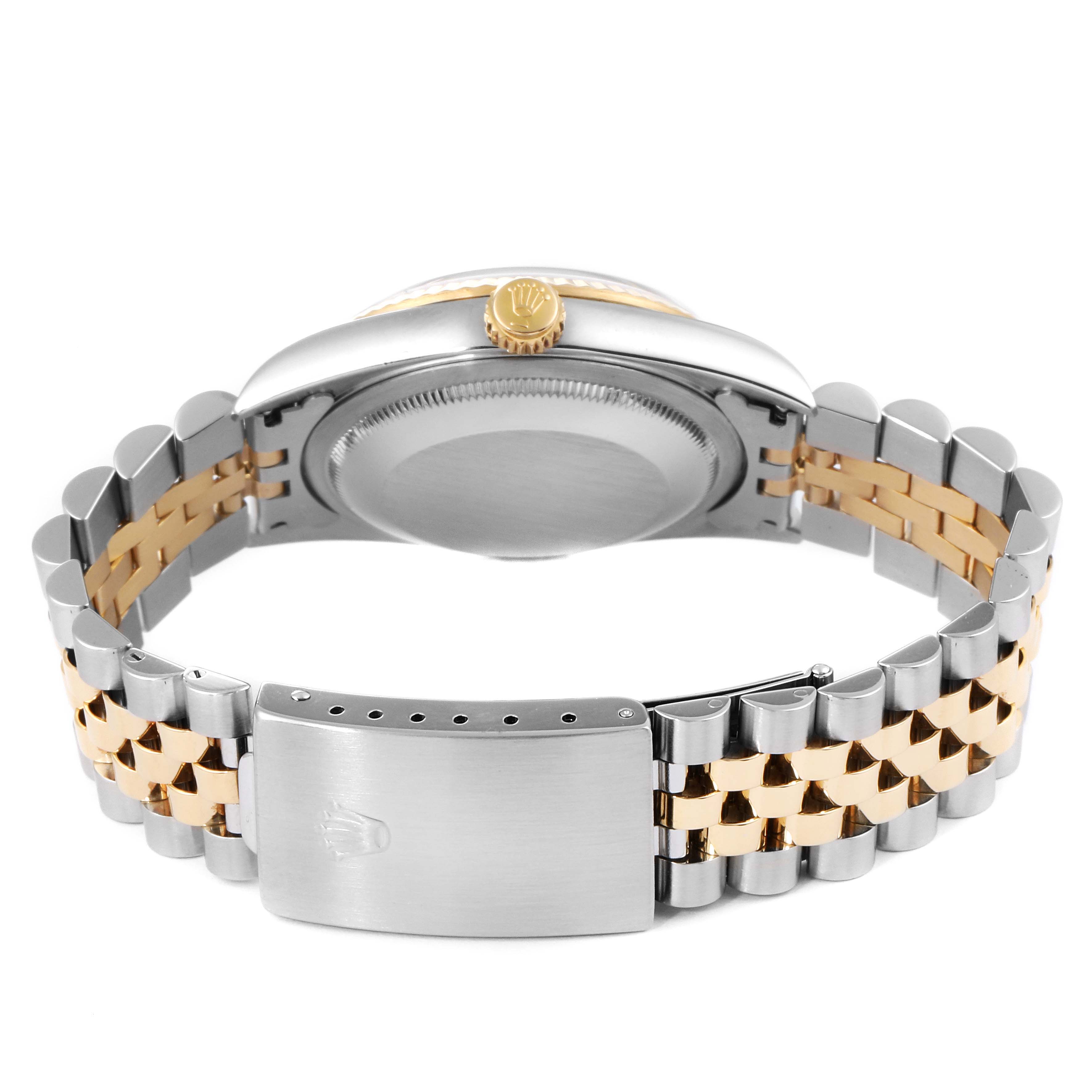 The image shows the back view of a Rolex Datejust 16233 Men's Steel and Gold (two tone) Black Dial 16233 Men's Steel and Gold (two tone) Black Dial watch emphasizing its two-tone bracelet and clasp.