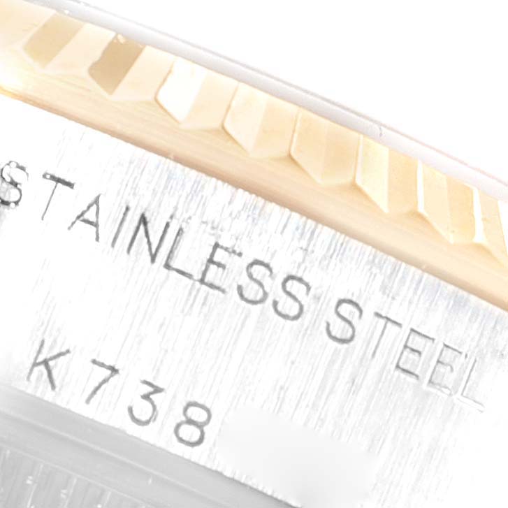 This close-up image shows the side engraving and the fluted bezel of a Rolex Datejust 79173 Women
s Steel and Gold (two tone) Champagne Dial 79173 Women
s Steel and Gold (two tone) Champagne Dial watch.