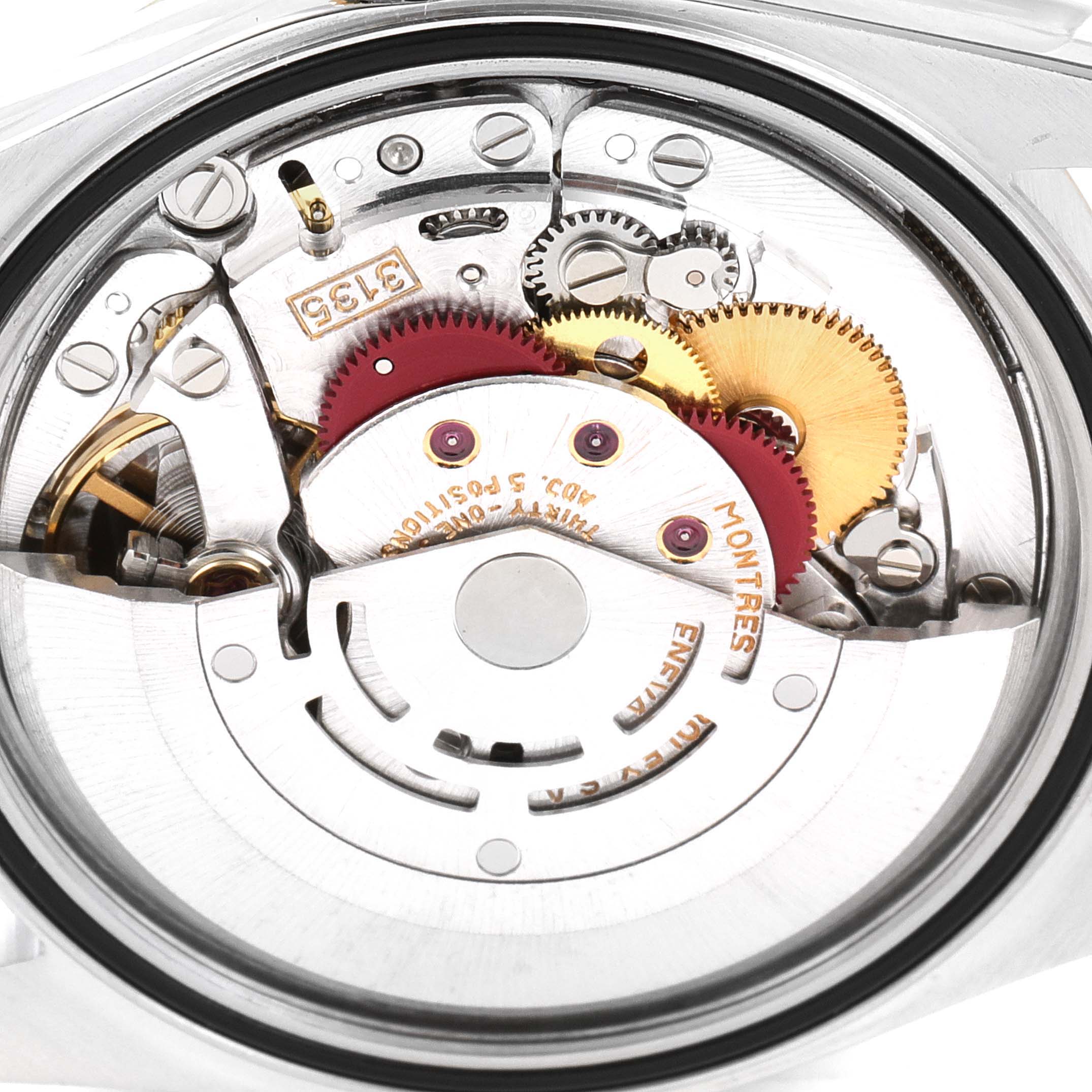 This image shows the internal mechanism of a Rolex Datejust 16233 Men's Steel and Gold (two tone) Champagne Dial 16233 Men's Steel and Gold (two tone) Champagne Dial watch viewed from the back, highlighting its intricate gears and rotor.