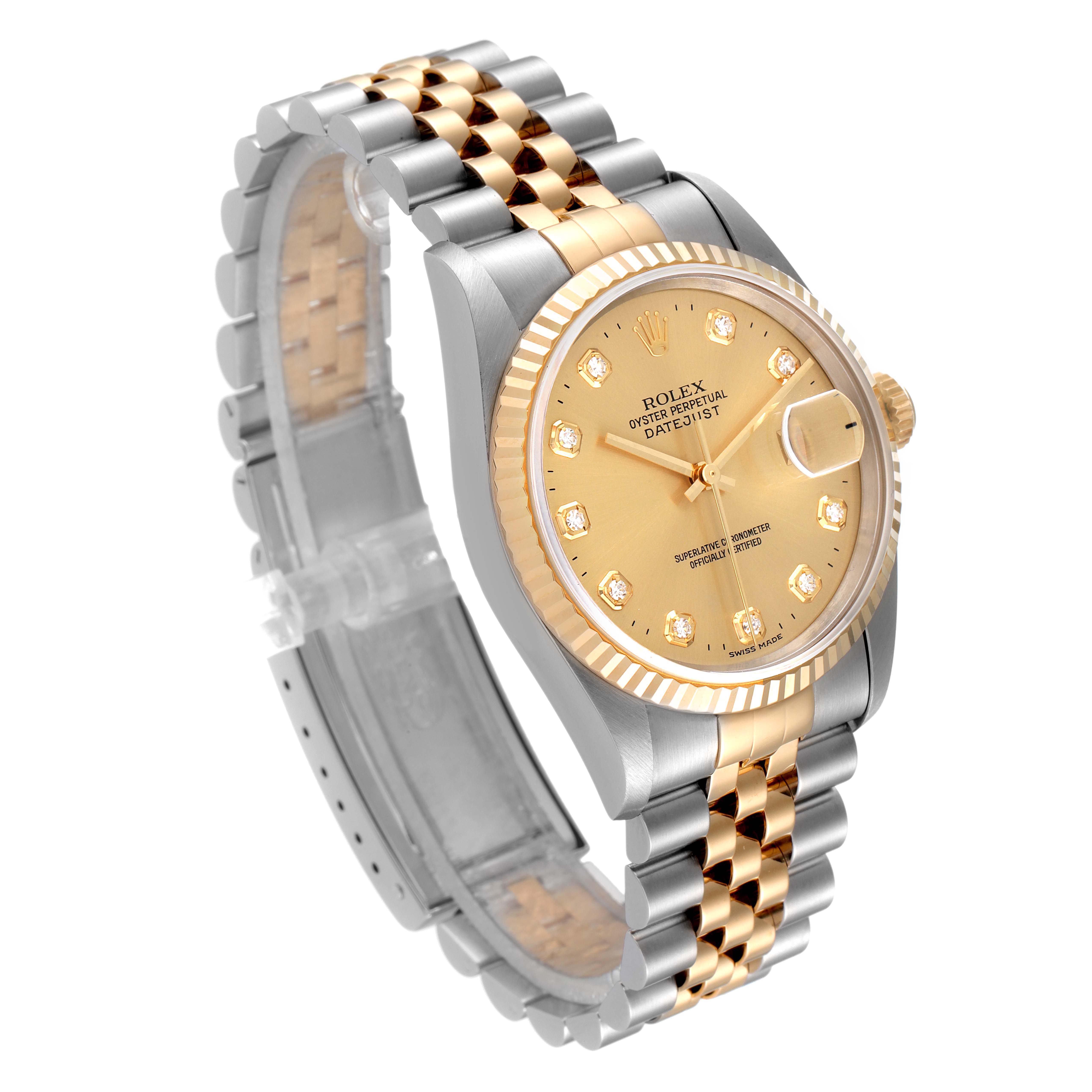 This image shows a Rolex Datejust 16233 Men
s Steel and Gold (two tone) Champagne Dial 16233 Men
s Steel and Gold (two tone) Champagne Dial watch at an angled view, highlighting its two-tone bracelet, dial, and fluted bezel.