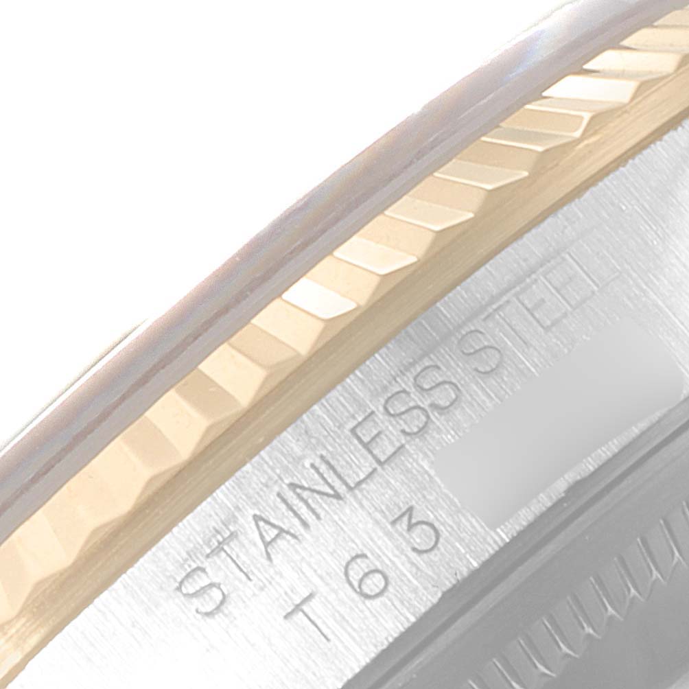 The image shows a close-up of the bezel and part of the case of a Rolex Datejust 16233 Men's Steel and Gold (two tone) Champagne Dial 16233 Men's Steel and Gold (two tone) Champagne Dial watch, highlighting the "STAINLESS STEEL" engraving.