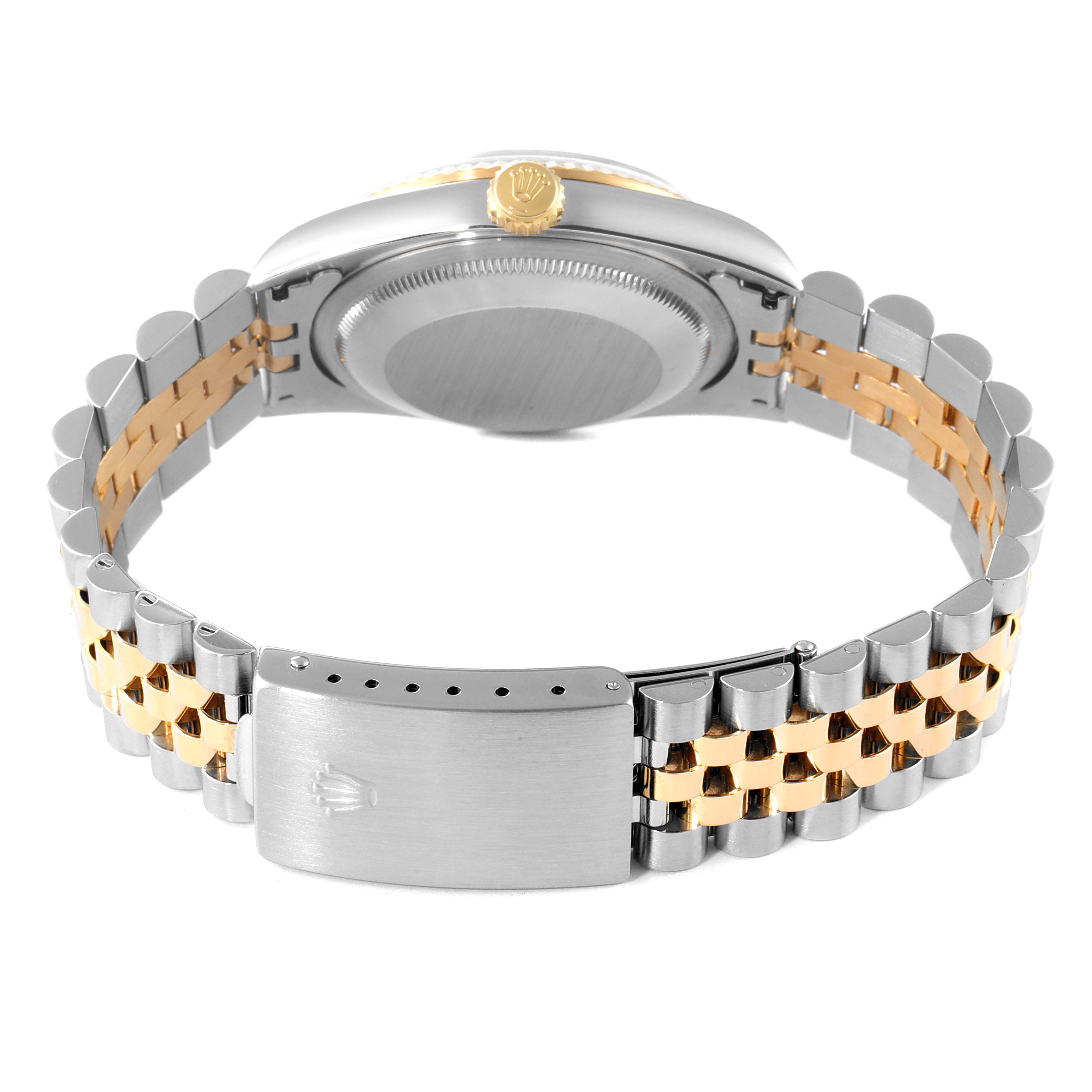 This image shows a side angle of a Rolex Datejust 16233 Men's Steel and Gold (two tone) Champagne Dial 16233 Men's Steel and Gold (two tone) Champagne Dial watch, highlighting its two-tone bracelet and the case back.