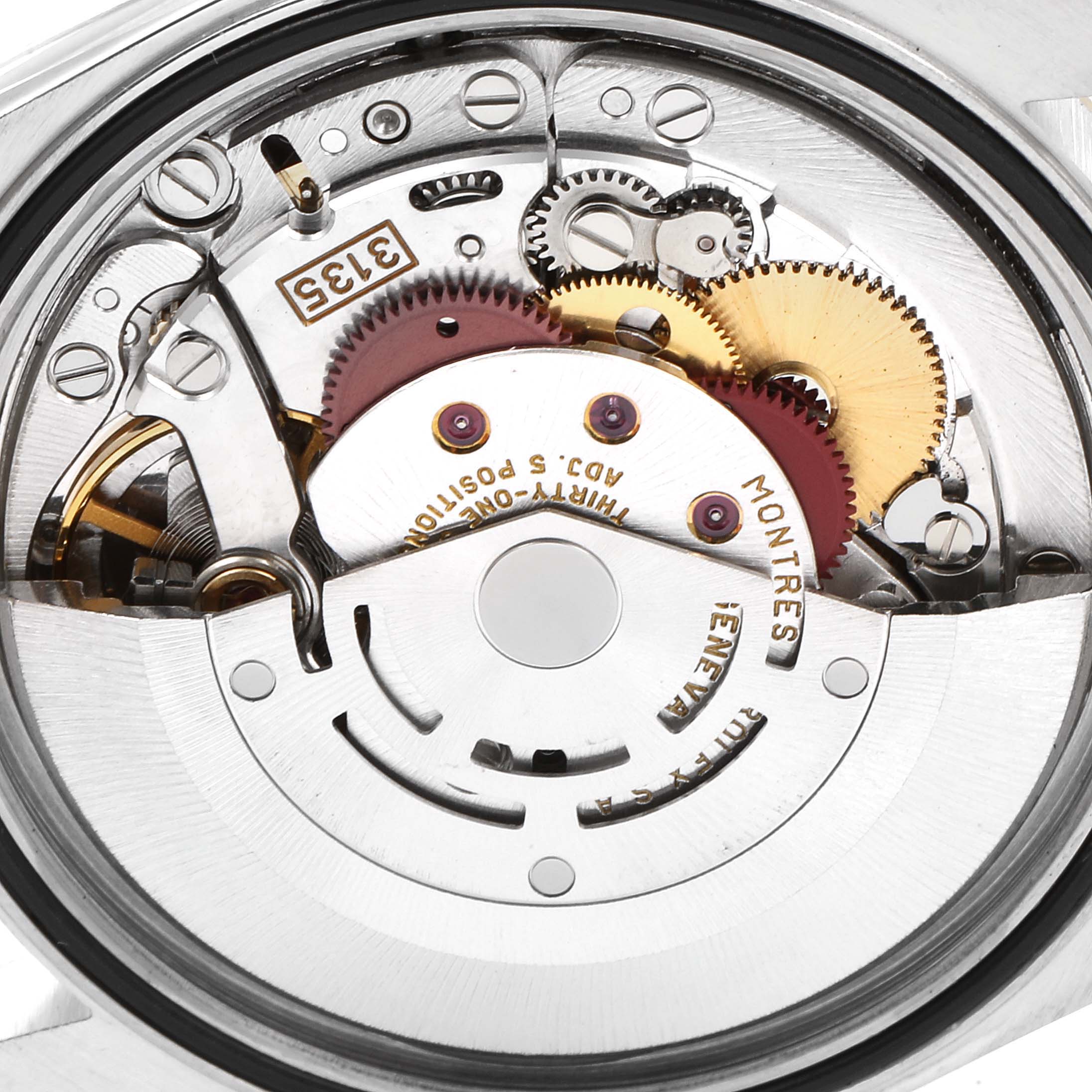 This is an interior close-up of the Rolex Datejust 16233 Men's Steel and Gold (two tone) Champagne Dial 16233 Men's Steel and Gold (two tone) Champagne Dial model, showing its intricate movement components and gears.