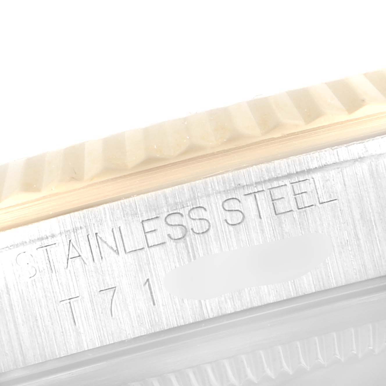 This close-up image shows the stainless steel casing and fluted bezel of a Rolex Datejust 16233 Men's Steel and Gold (two tone) Champagne Dial 16233 Men's Steel and Gold (two tone) Champagne Dial watch.