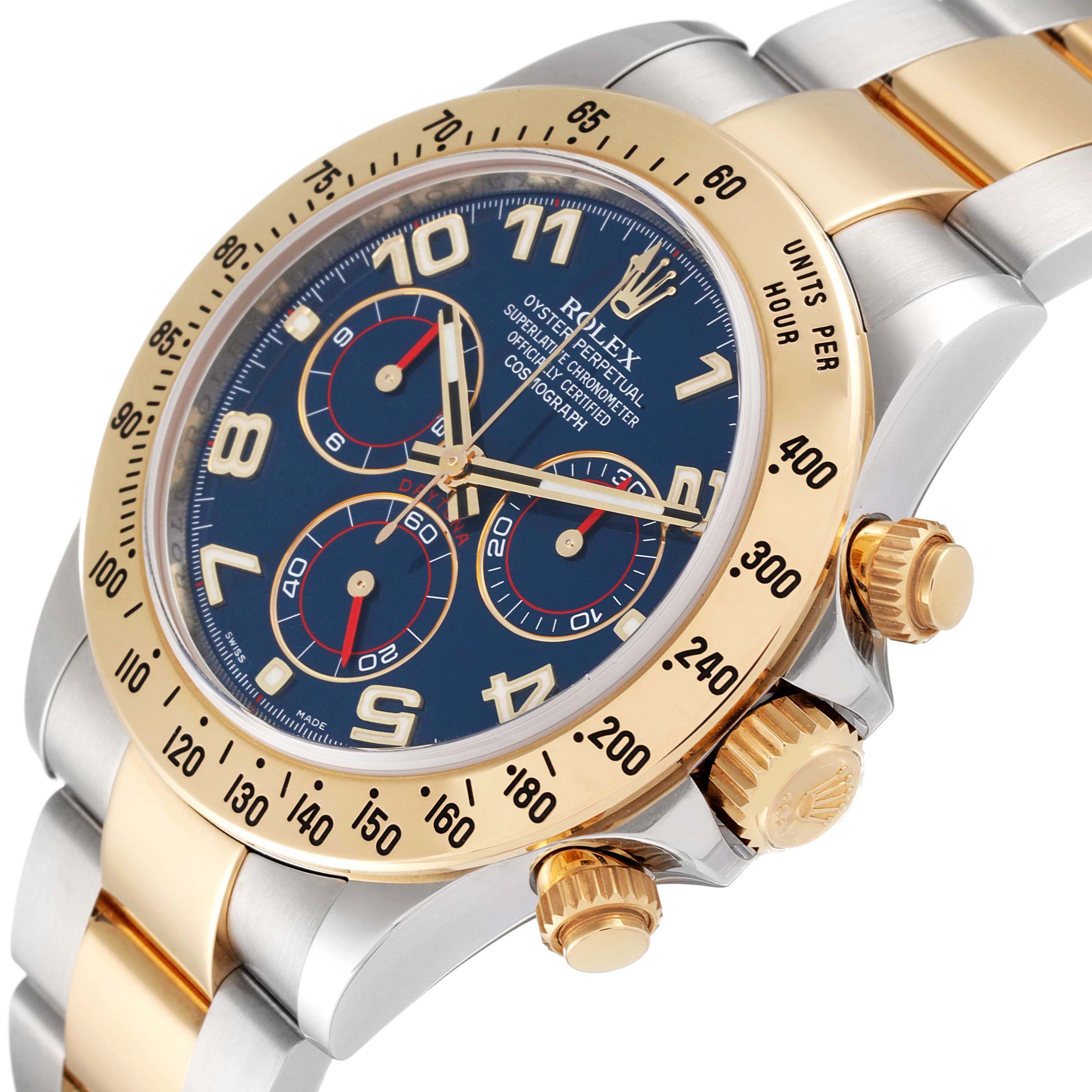 This image shows a close-up angle of the Rolex Daytona 116523 Men
s Steel and Gold (two tone) Blue Dial 116523 Men
s Steel and Gold (two tone) Blue Dial watch, highlighting the bezel, dial, crown, and part of the bracelet.