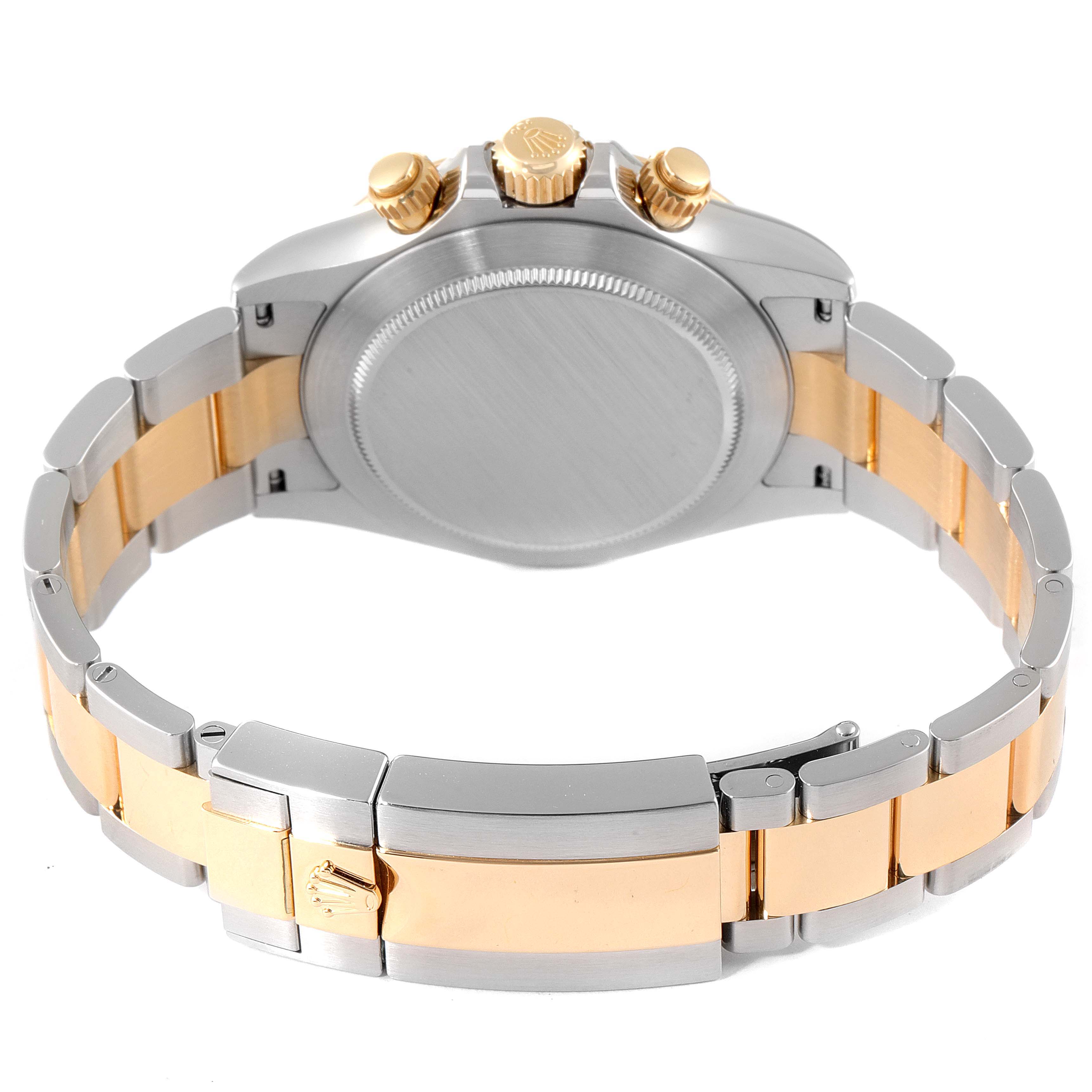 This image shows the back view of a Rolex Daytona 116523 Men
s Steel and Gold (two tone) Blue Dial 116523 Men
s Steel and Gold (two tone) Blue Dial watch, highlighting the case back, strap, and clasp.