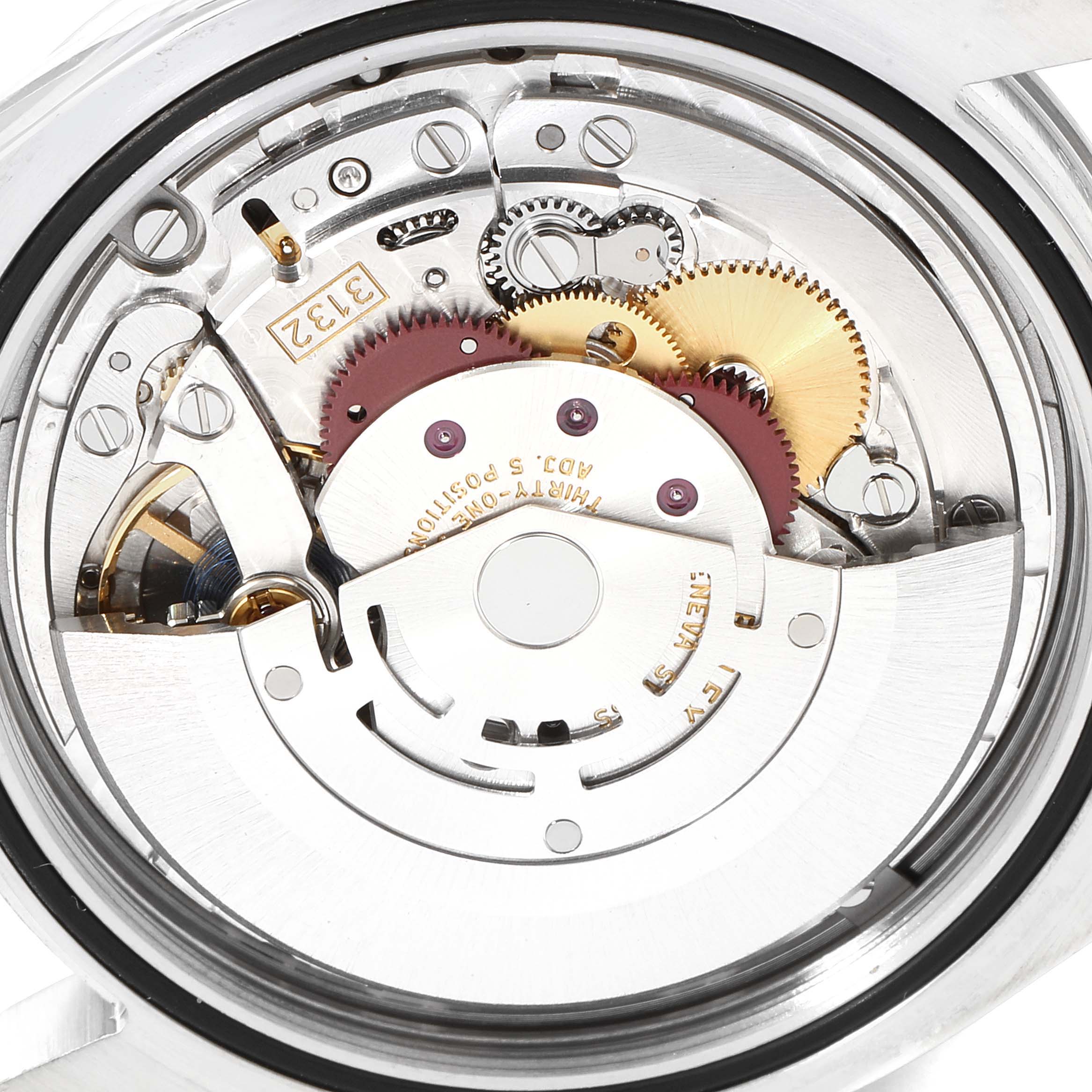 This image shows the inner mechanics of a Rolex Explorer 214270 Men
s Stainless Steel Black Dial 214270 Men
s Stainless Steel Black Dial watch, viewed from the back with various gears, rotors, and intricate components visible.
