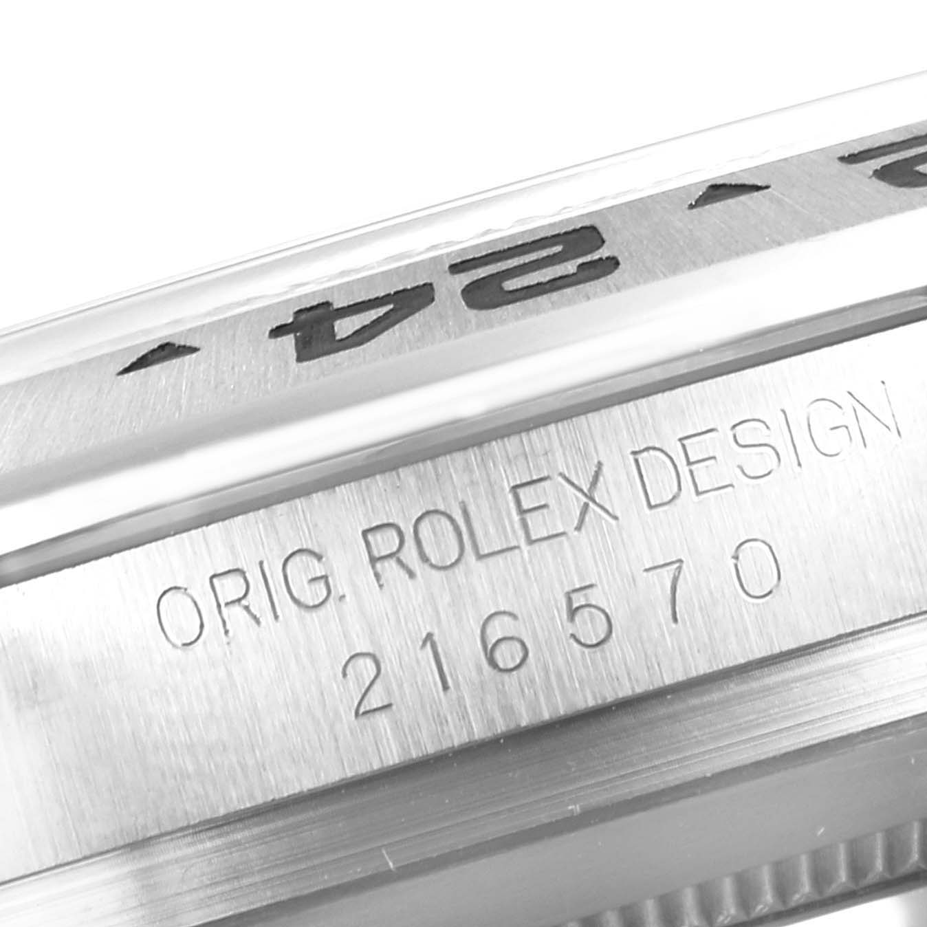 This image shows a close-up of the side of the Rolex Explorer 216570 Men
s Stainless Steel White Dial 216570 Men
s Stainless Steel White Dial watch, featuring the engraving "ORIG. ROLEX DESIGN 216570."