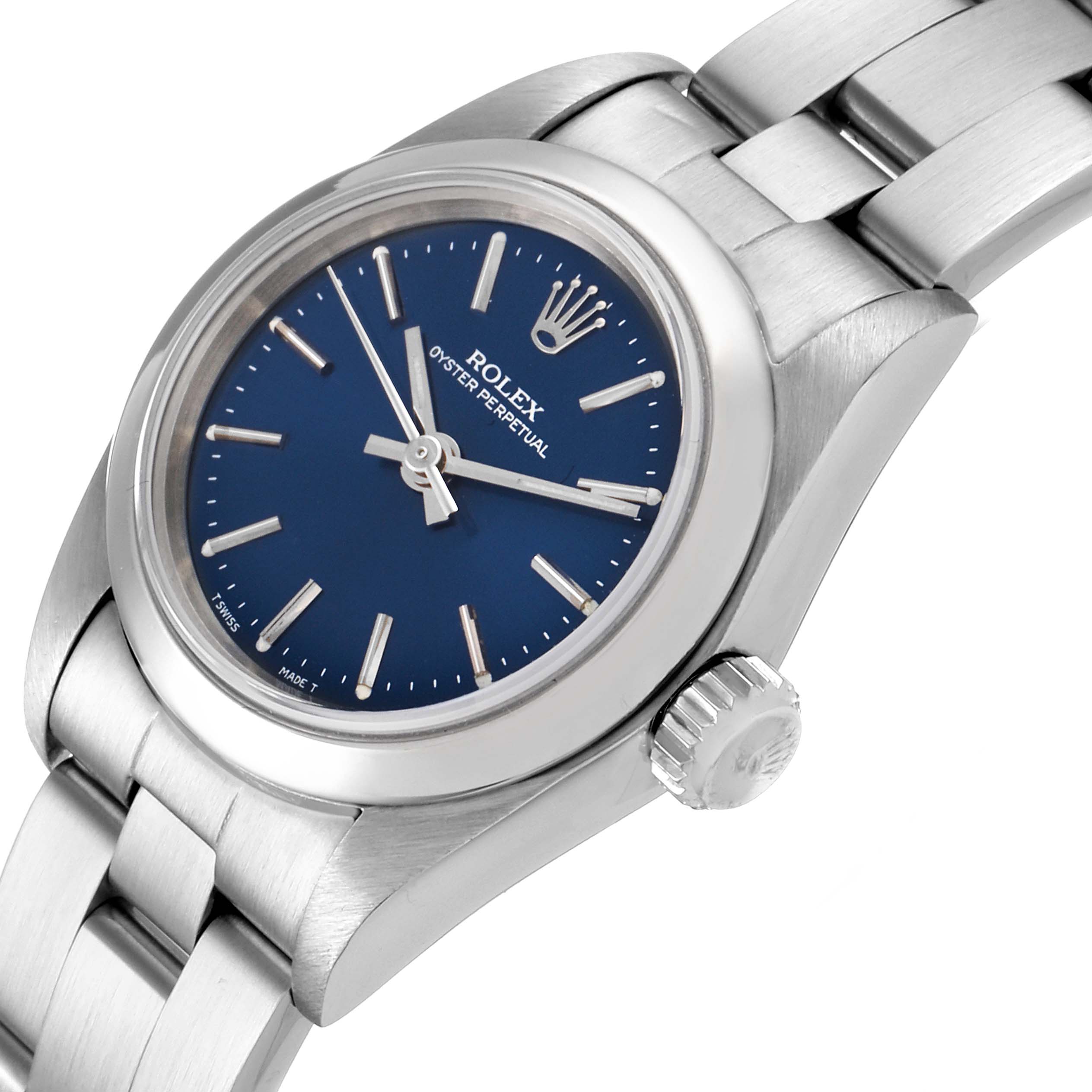 This image shows a close-up angle of the face, crown, and part of the band of a Rolex Oyster Perpetual 67180 Women
s Stainless Steel Blue Dial 67180 Women
s Stainless Steel Blue Dial watch.