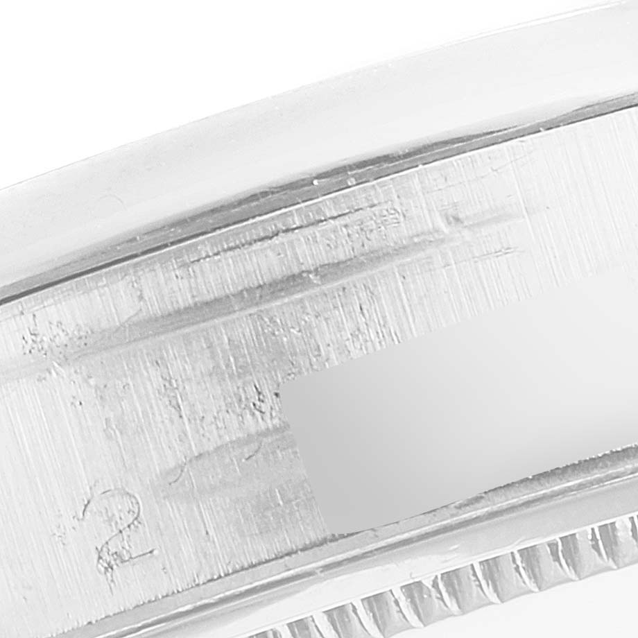 This image shows a close-up angle of the side of the bezel and serial number engraving of the Rolex Vintage Collection 6694 Men's Stainless Steel Silver Dial 6694 Men's Stainless Steel Silver Dial model.