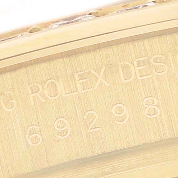 This image shows a close-up of the side engraving on a Rolex Pearlmaster 69298 Women's Yellow Gold Mother of Pearl Dial 69298 Women's Yellow Gold Mother of Pearl Dial watch, featuring the model number.