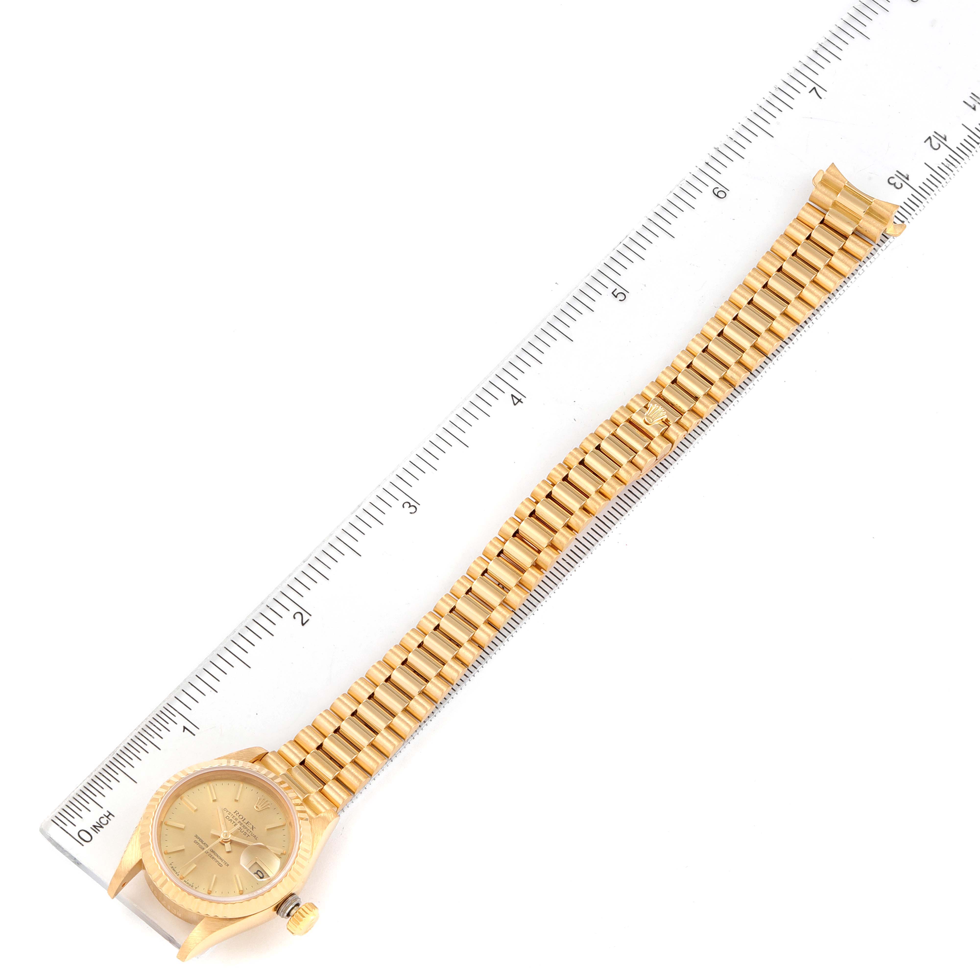 The image shows a top-down view of a Rolex President 69178 Women's Yellow Gold Champagne Dial 69178 Women's Yellow Gold Champagne Dial model watch, displaying the face, band, and partial clasp.