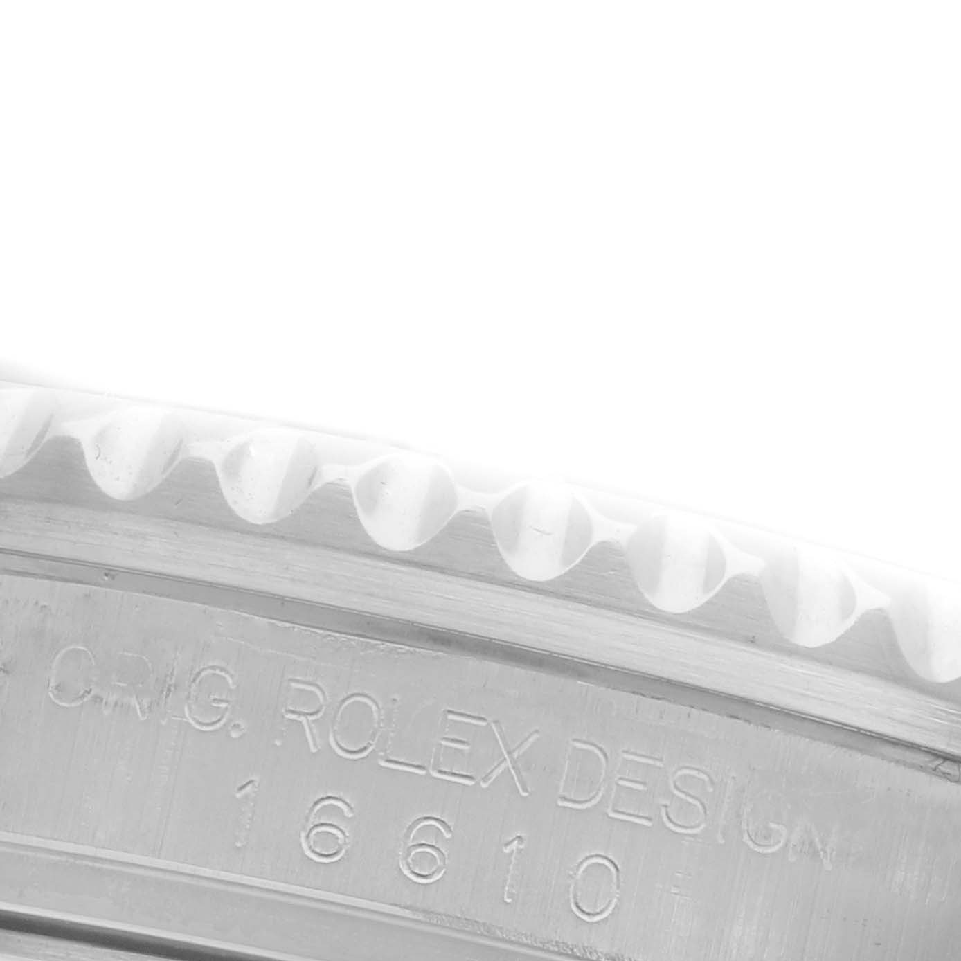 The image shows a close-up of the engravings on the side of a Rolex Submariner 16610 Men's Stainless Steel Black Dial 16610 Men's Stainless Steel Black Dial model.
