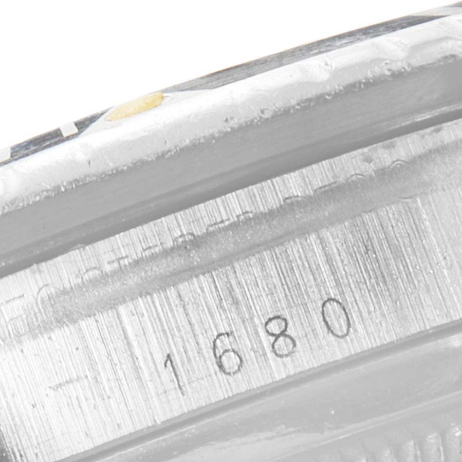 The image shows a close-up view of the serial number, "1680," engraved on the case of a Rolex Submariner 1680 Men's Stainless Steel Black Dial 1680 Men's Stainless Steel Black Dial watch.