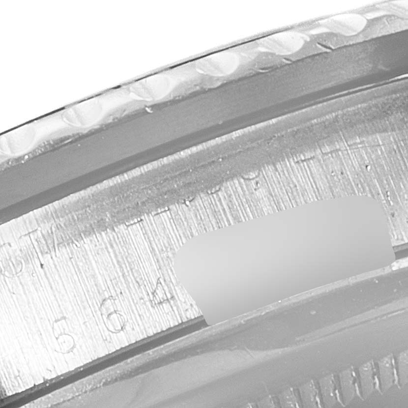 This image shows a close-up of the engraved rehaut of a Rolex Submariner 1680 Men's Stainless Steel Black Dial 1680 Men's Stainless Steel Black Dial watch.