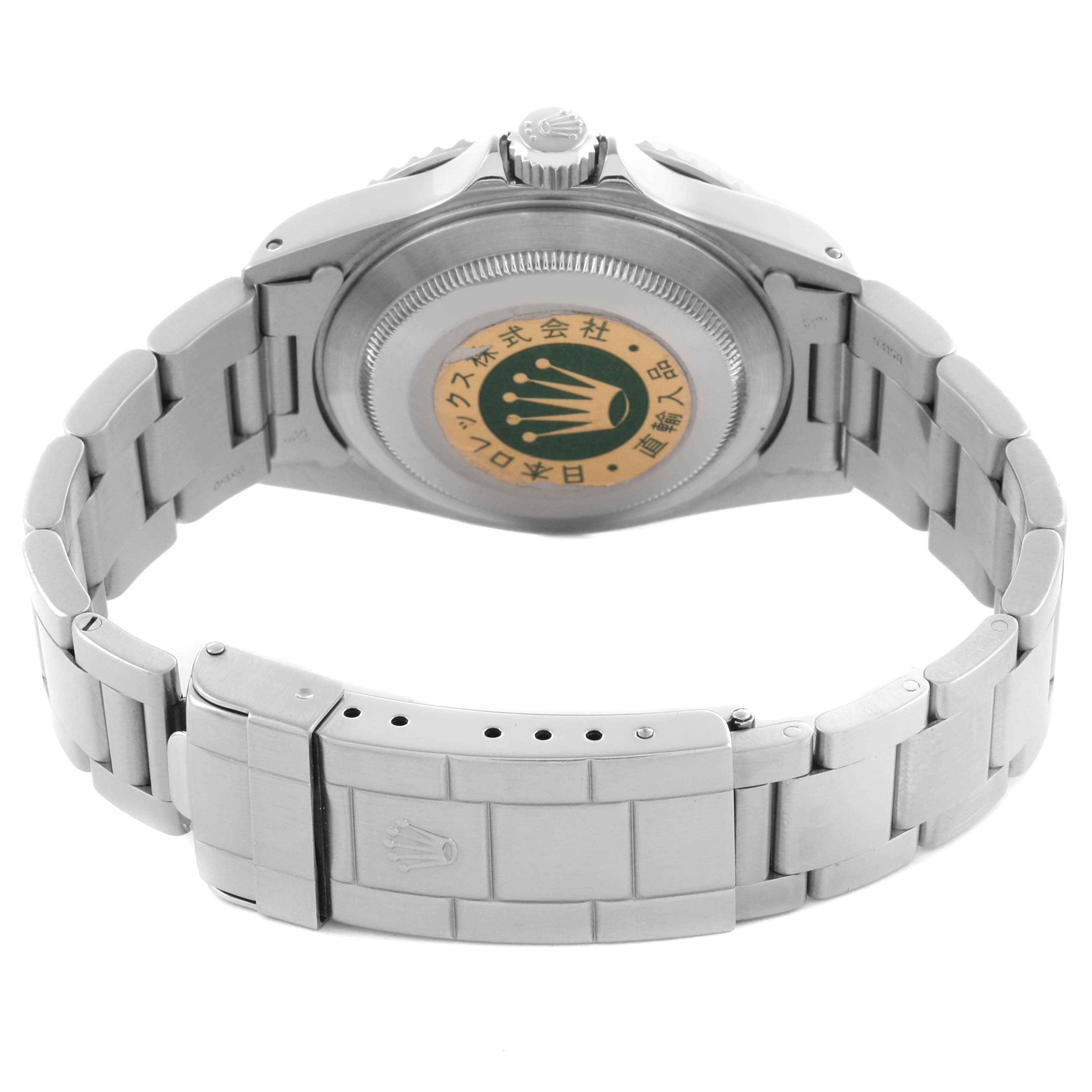 The image shows the back view of a Rolex Submariner 14060M Men's Stainless Steel Black Dial 14060M Men's Stainless Steel Black Dial, highlighting the case back and bracelet clasp.