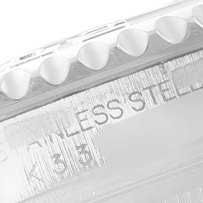 The image shows a close-up of the bezel and part of the casing with engraved text "STAINLESS STEEL" on a Rolex Yacht-Master 16622 Men's Stainless Steel Silver Dial 16622 Men's Stainless Steel Silver Dial watch.