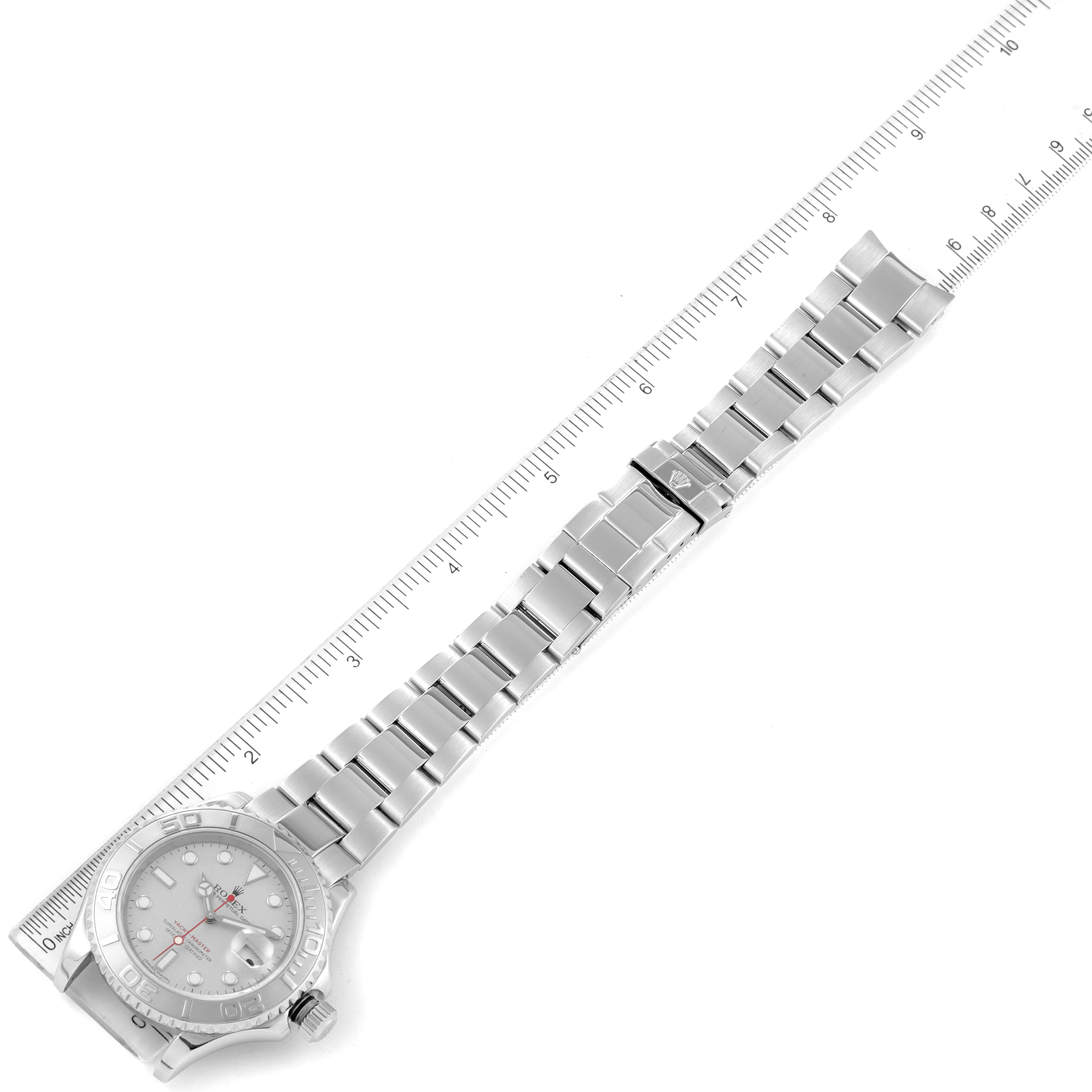 The image shows a top-down view of a Rolex Yacht-Master 16622 Men's Stainless Steel Silver Dial 16622 Men's Stainless Steel Silver Dial watch laid flat with a ruler beside it.