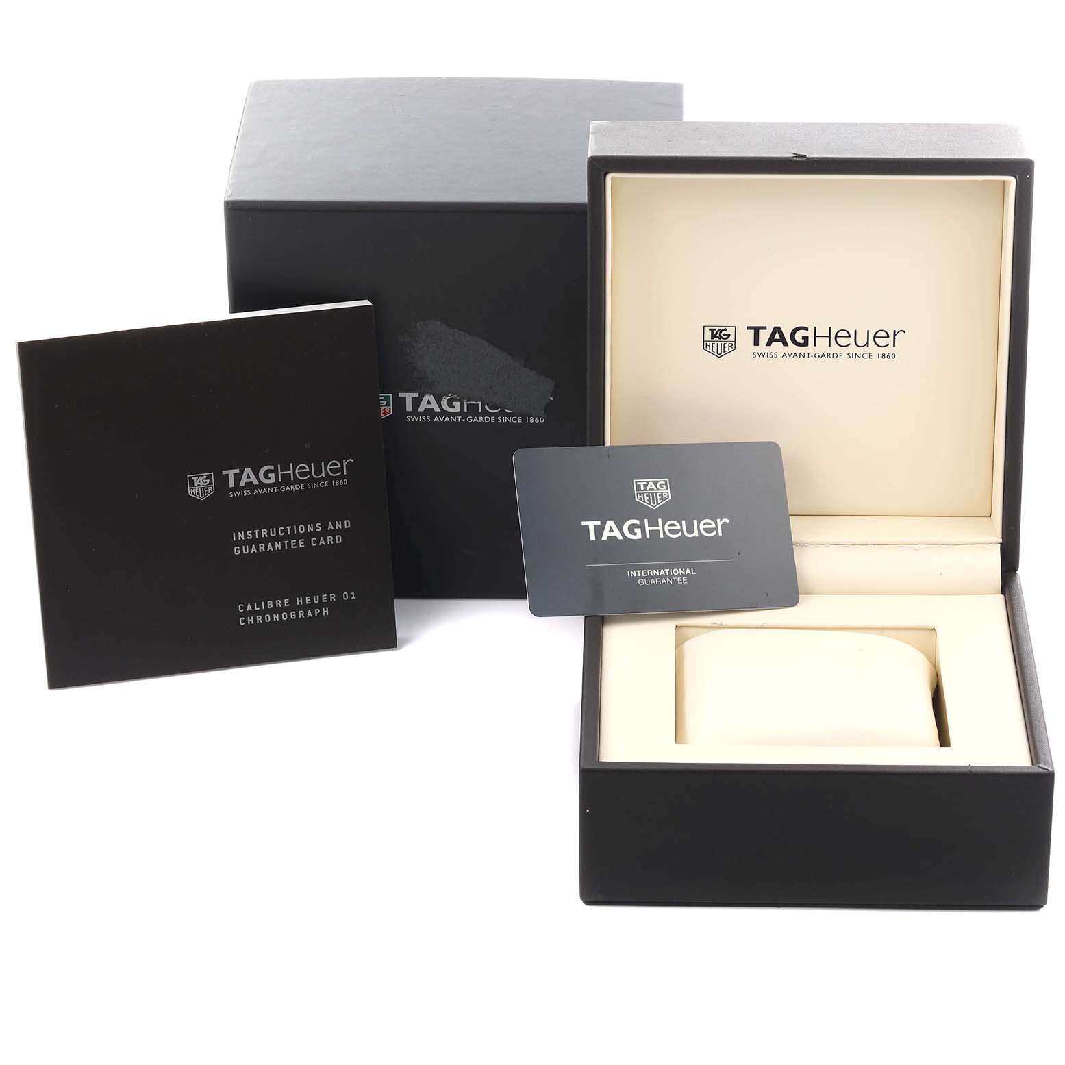 The image shows a Tag Heuer Carrera CAR2A90.FT6071 Men's Ceramic Black Dial CAR2A90.FT6071 Men's Ceramic Black Dial watch box, instruction booklet, and guarantee card from a front angle.