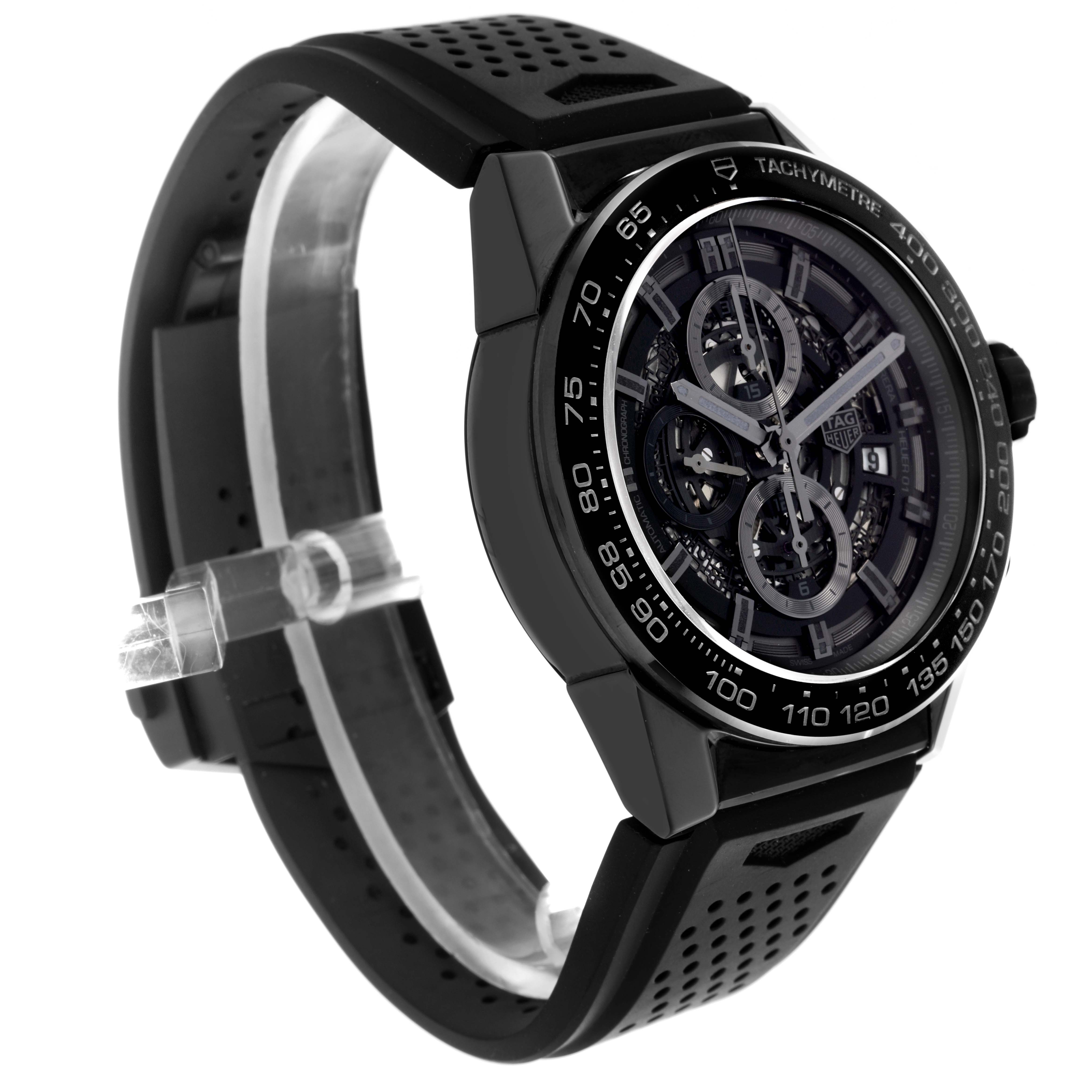 The Tag Heuer Carrera CAR2A90.FT6071 Men's Ceramic Black Dial CAR2A90.FT6071 Men's Ceramic Black Dial watch is shown at a three-quarter angle, highlighting its dial, case, and black perforated strap.